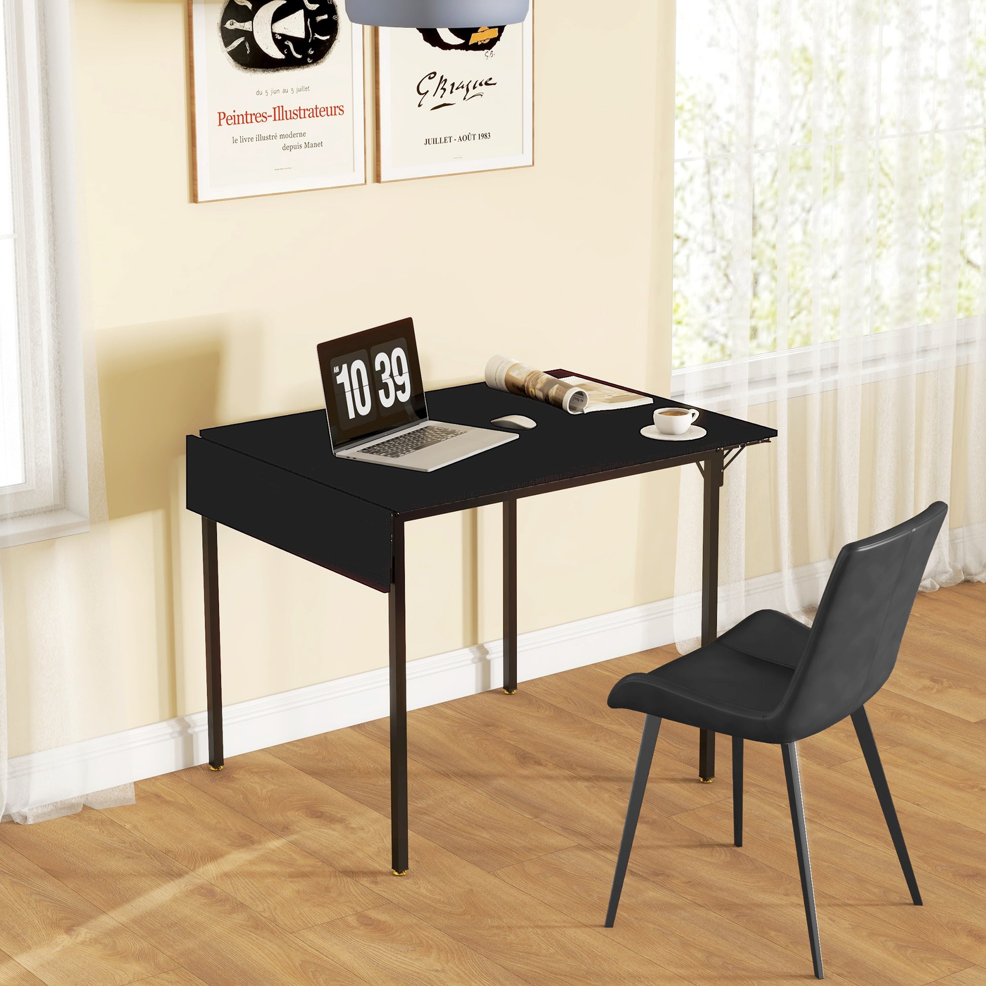Black minimalist desk with laptop and chair