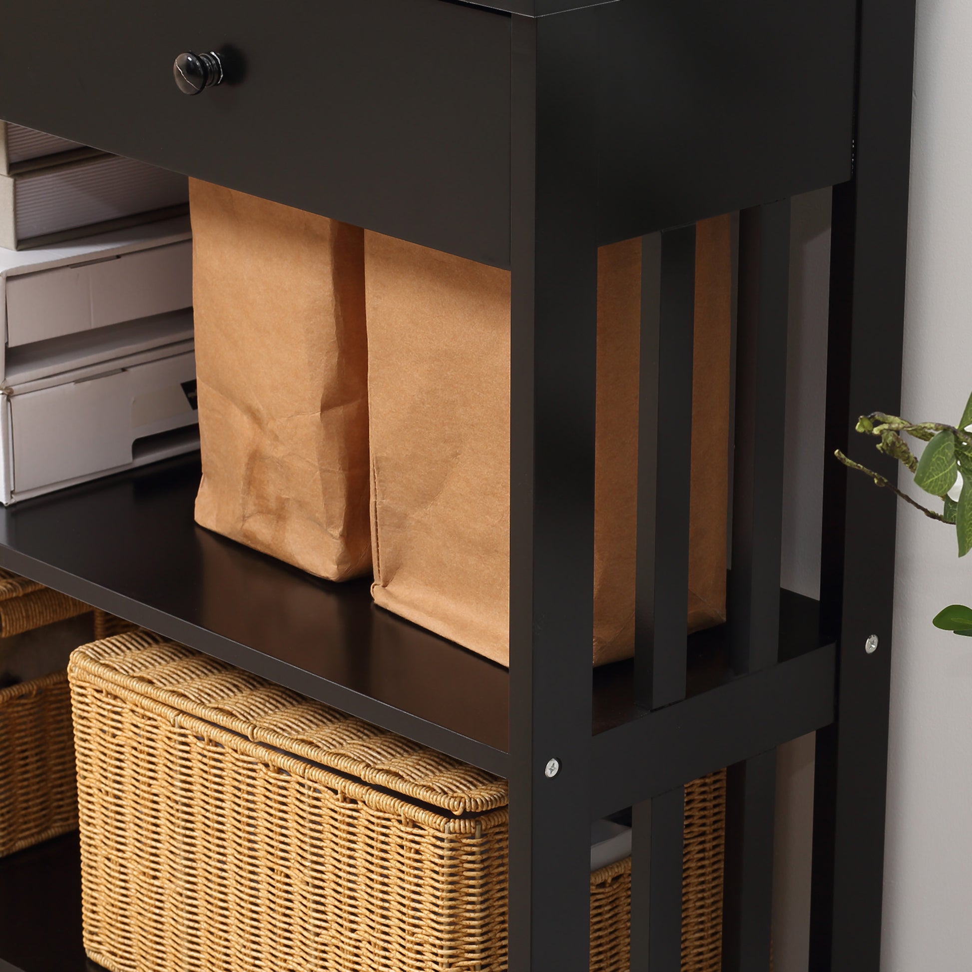 Black wood accent table with woven storage baskets
