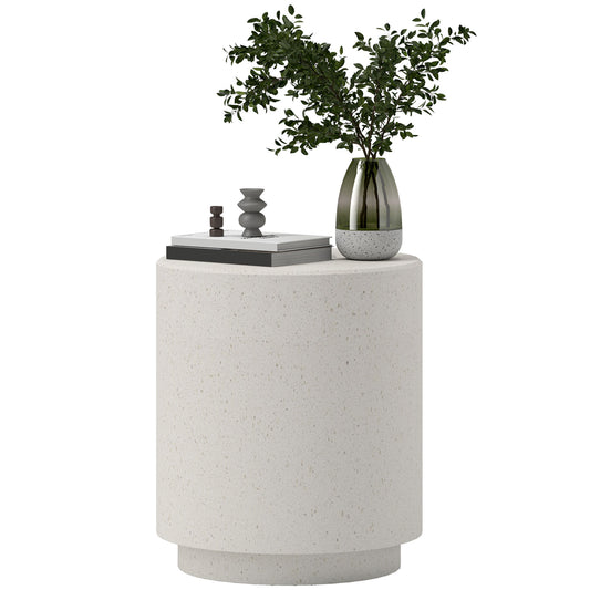 White terrazzo round side table with decorative objects