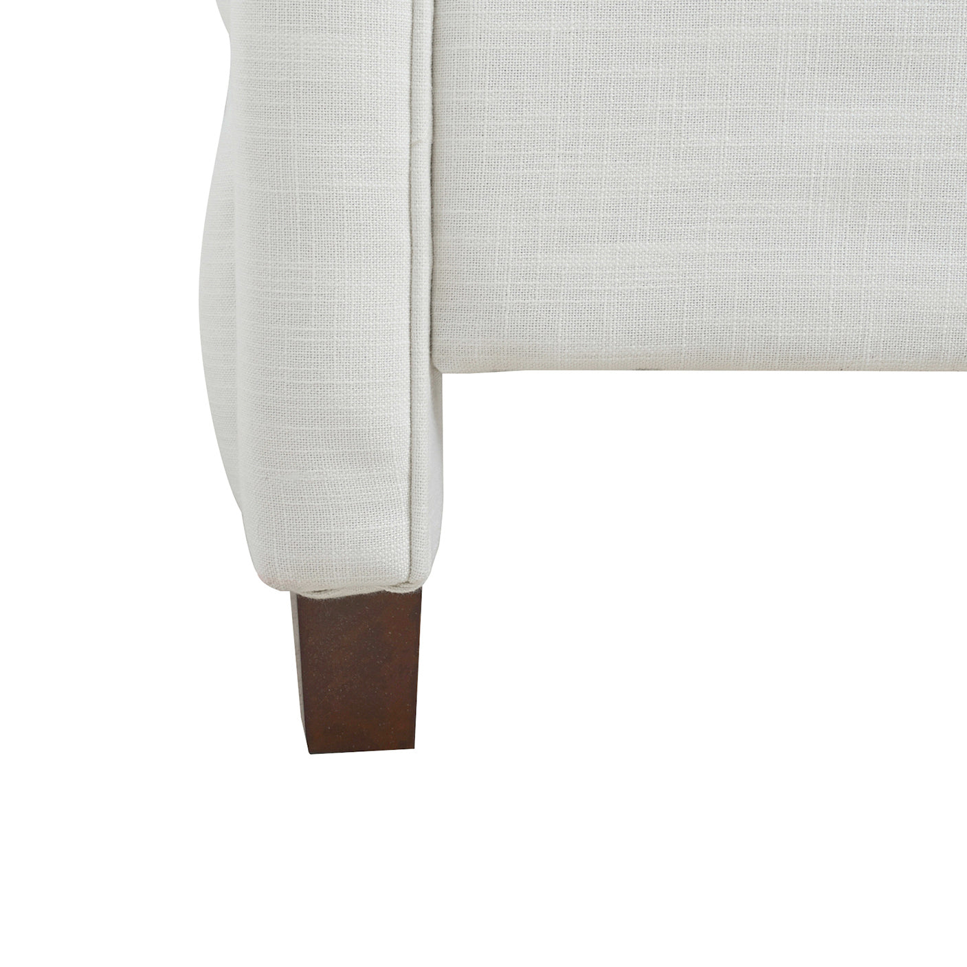 White textured fabric armchair leg with dark wooden foot
