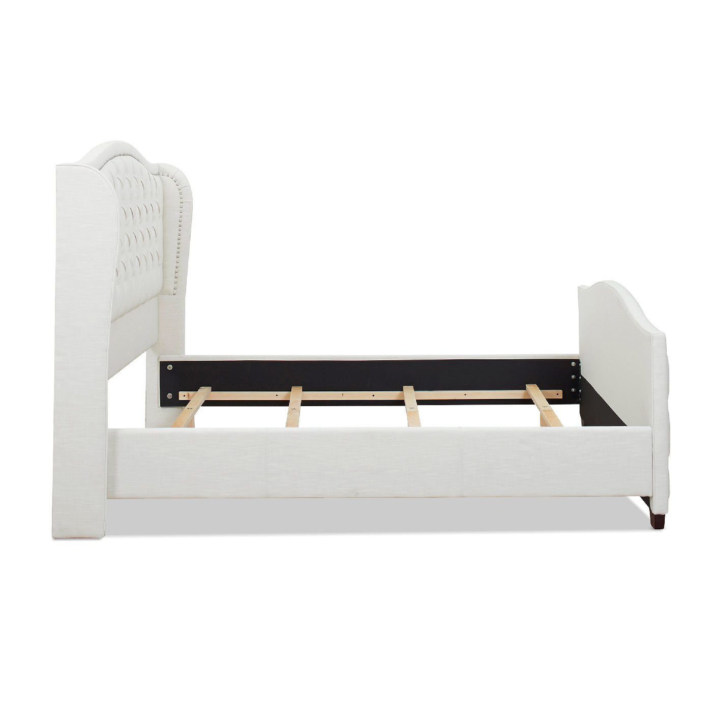 White upholstered wingback bed frame with diamond tufting