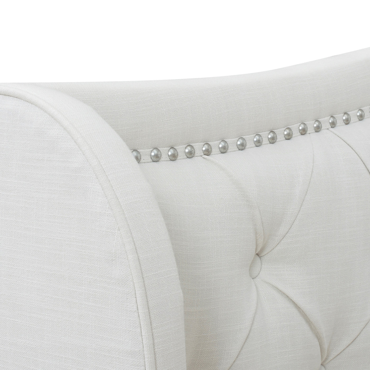 Tufted white linen armchair with silver nailhead trim accent