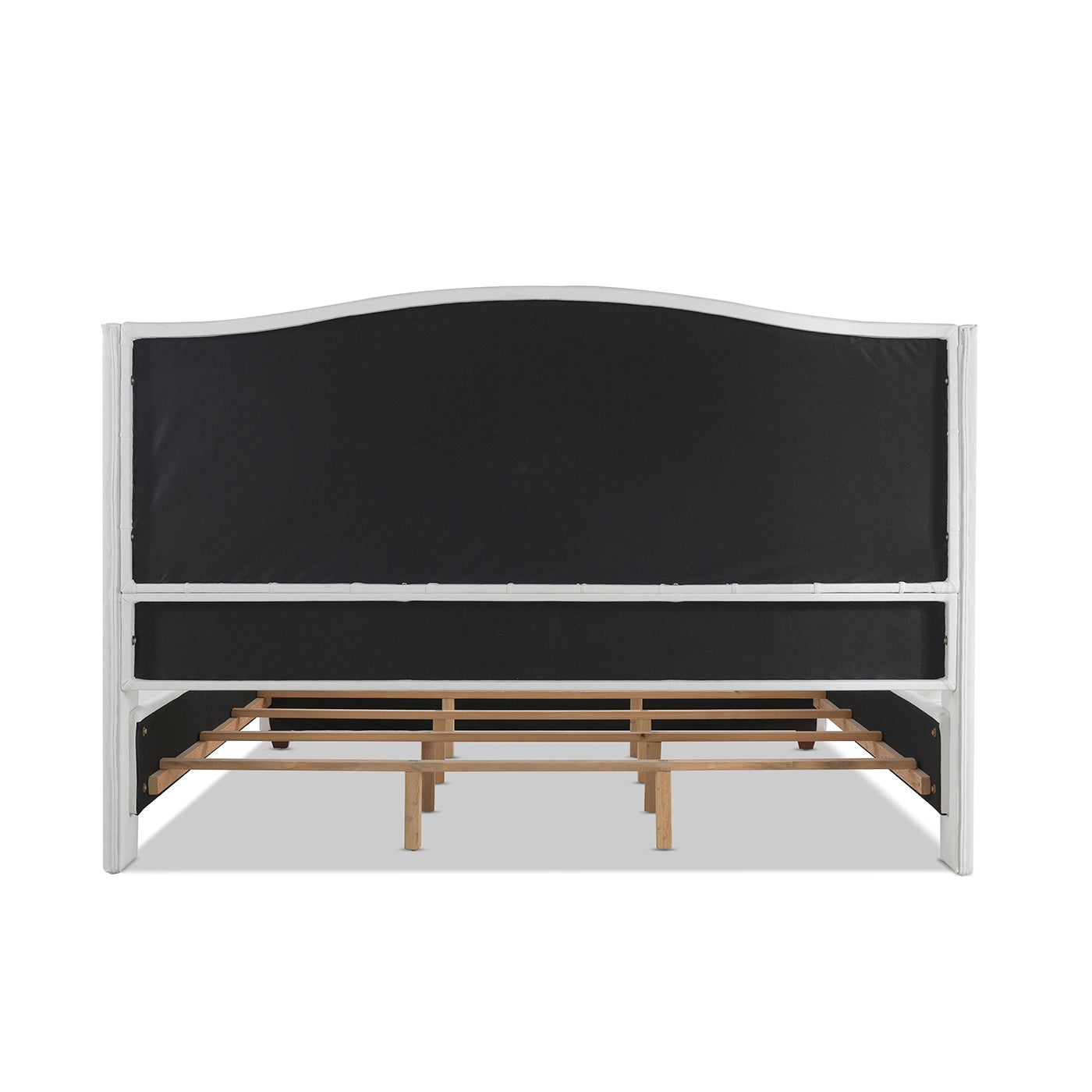 White upholstered headboard for a bed with exposed wooden frame