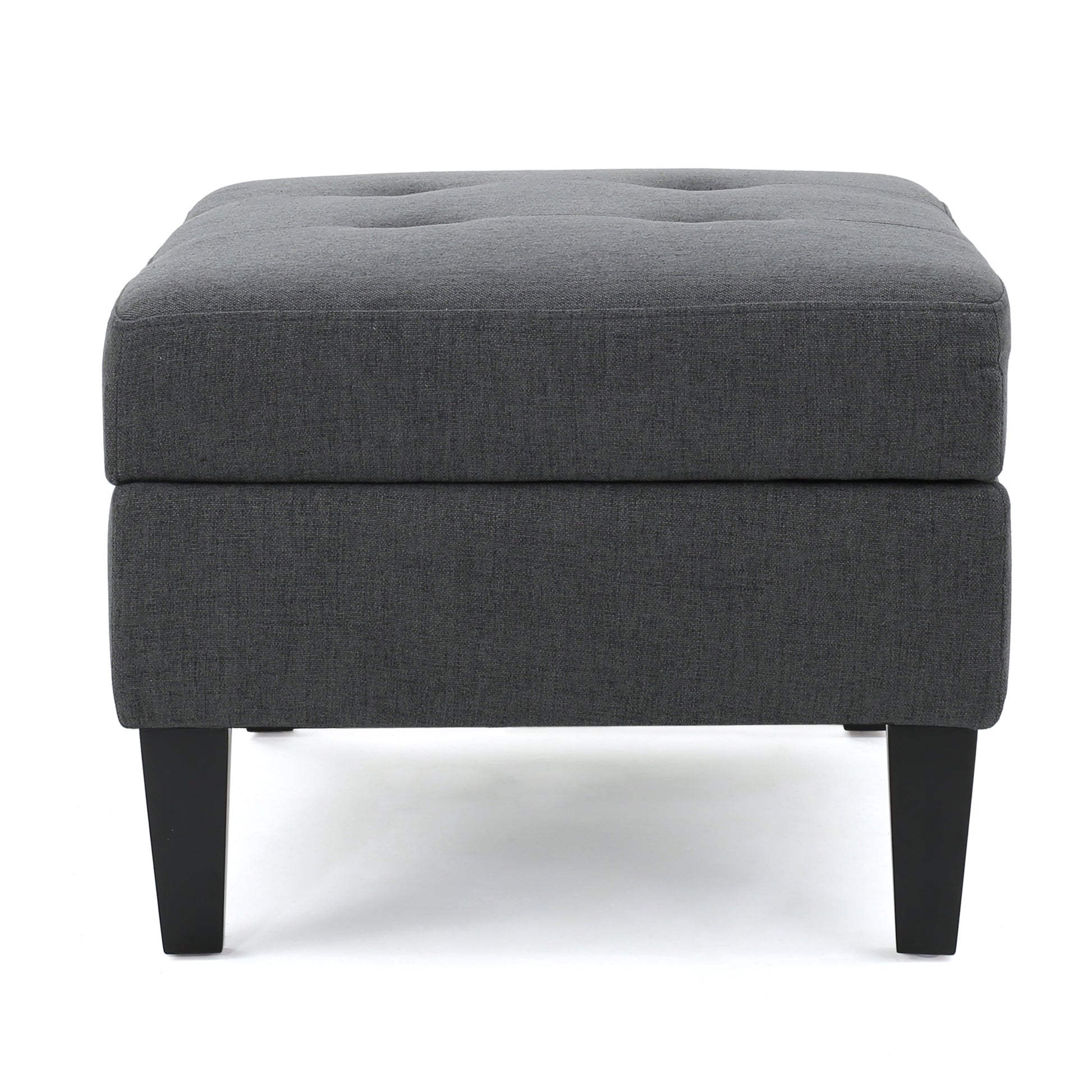 Dark grey fabric ottoman with tufted top and black legs
