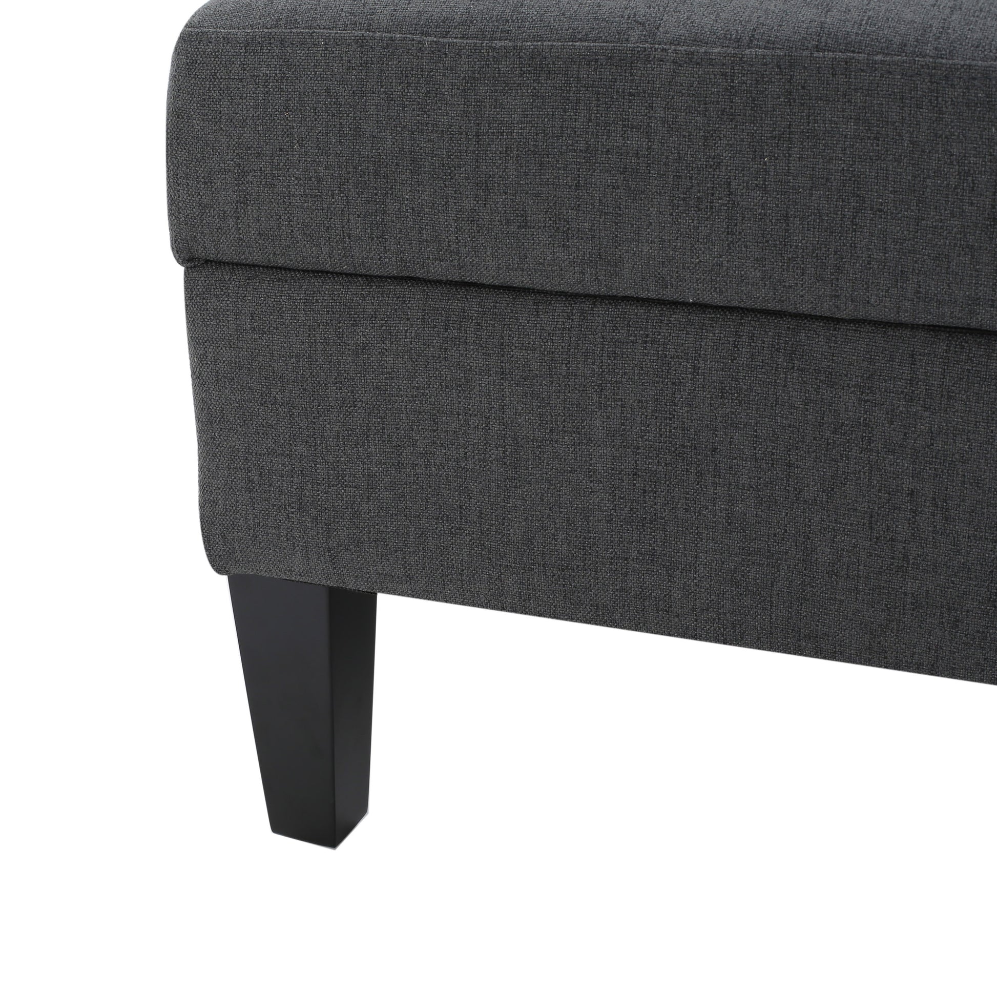 Dark gray fabric ottoman corner with modern black leg