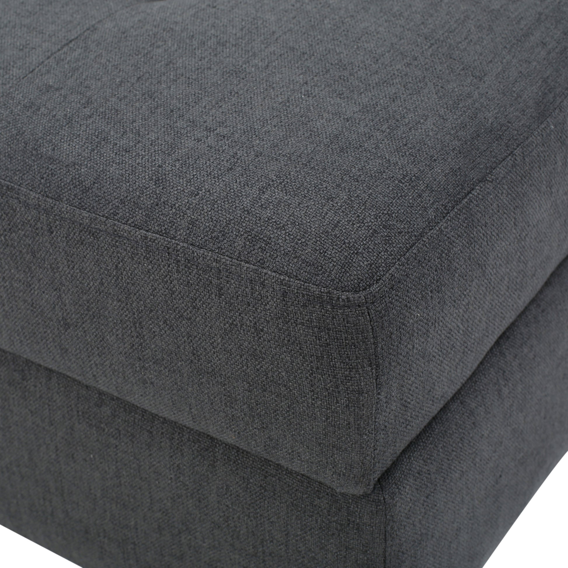Dark gray fabric ottoman corner detail