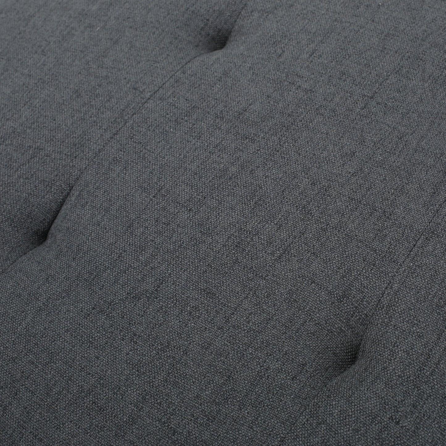 Dark grey tufted upholstered fabric texture