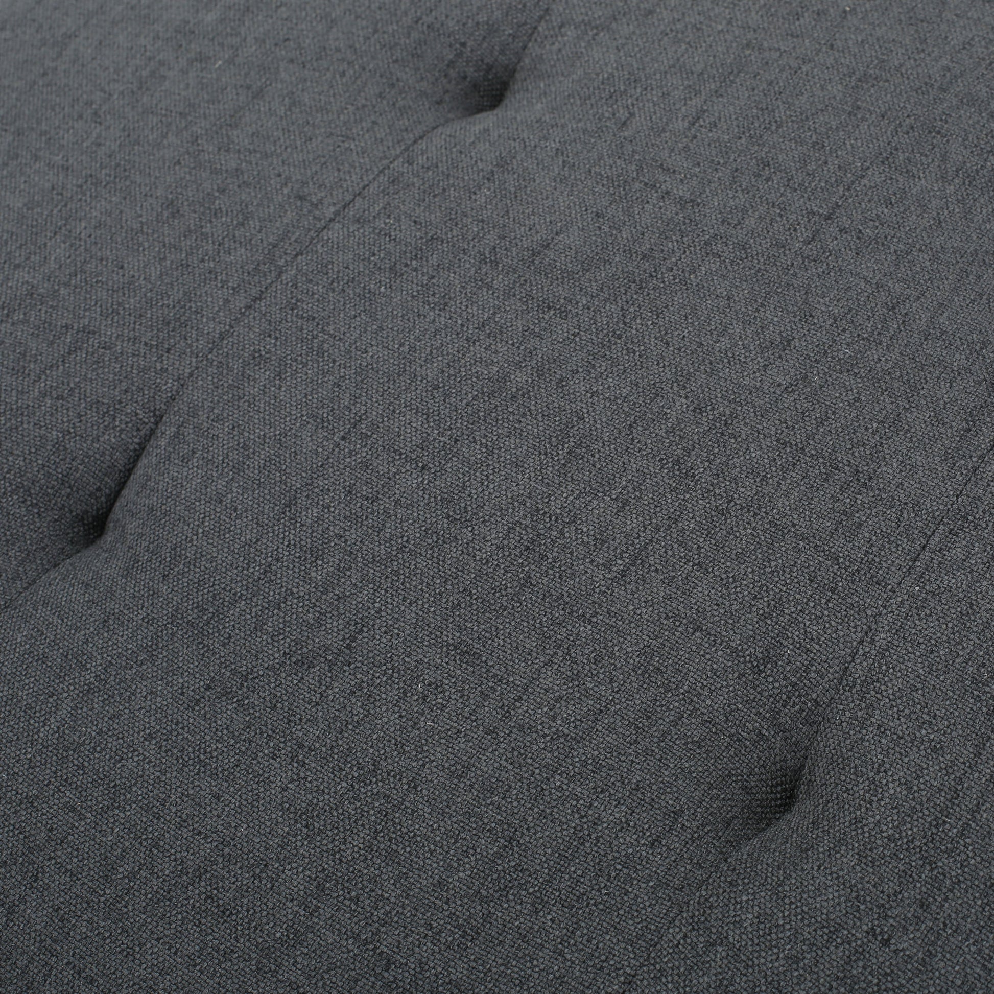 Dark grey tufted upholstered fabric texture