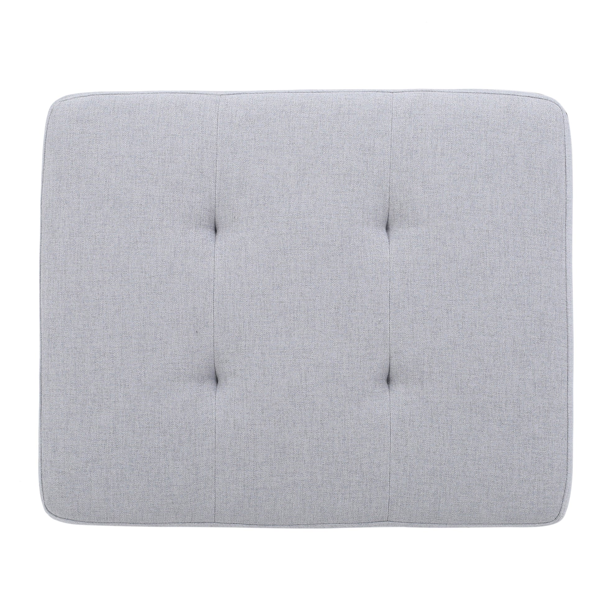 Grey upholstered headboard with button tufting