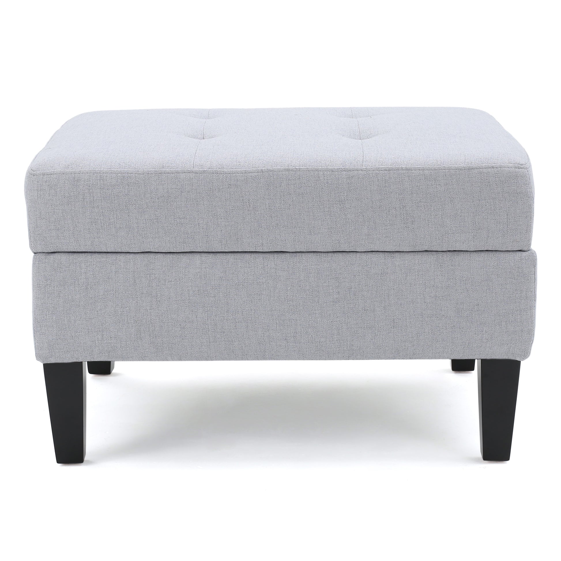Light gray upholstered storage ottoman with tufted top and black tapered legs