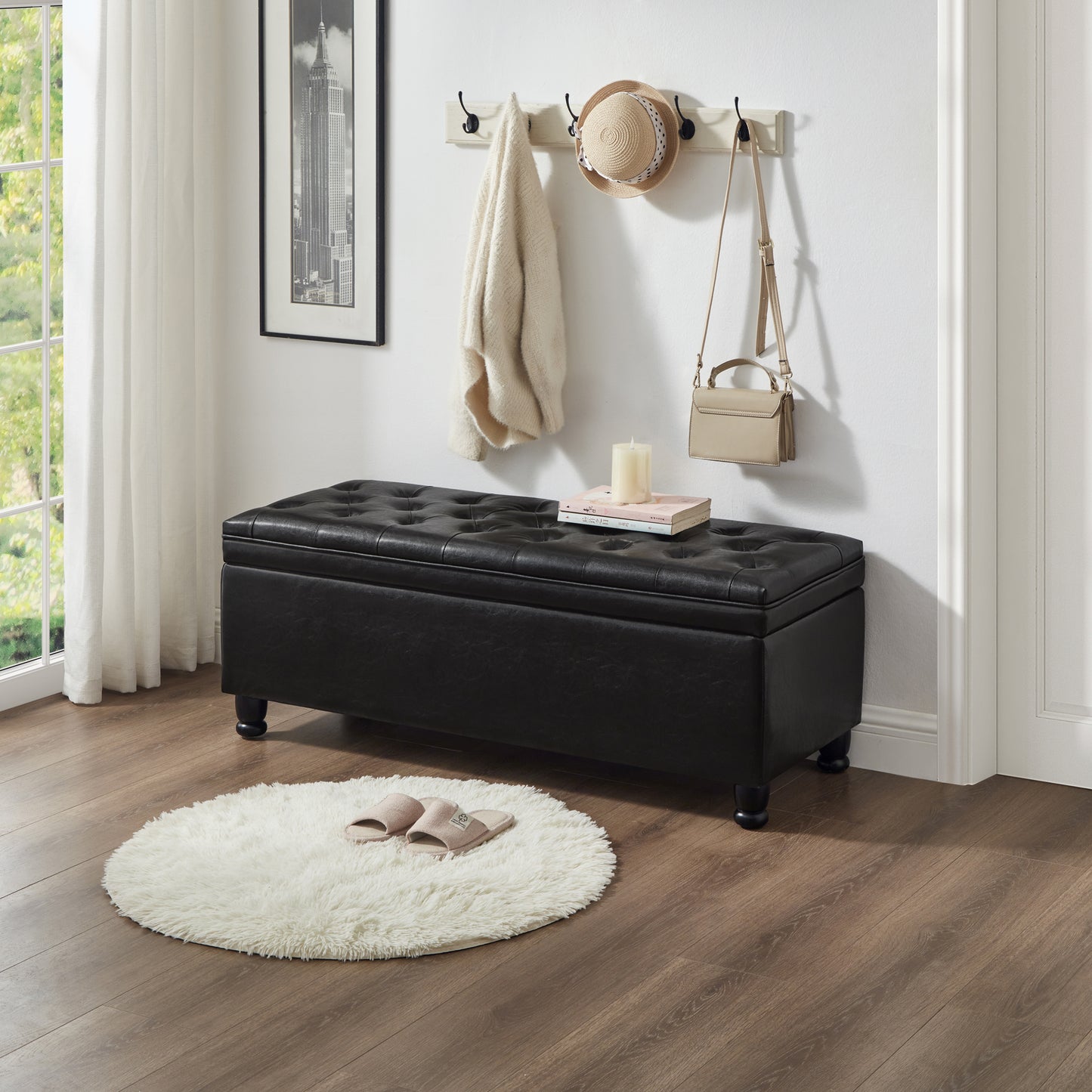 Black tufted faux leather storage ottoman with wooden legs