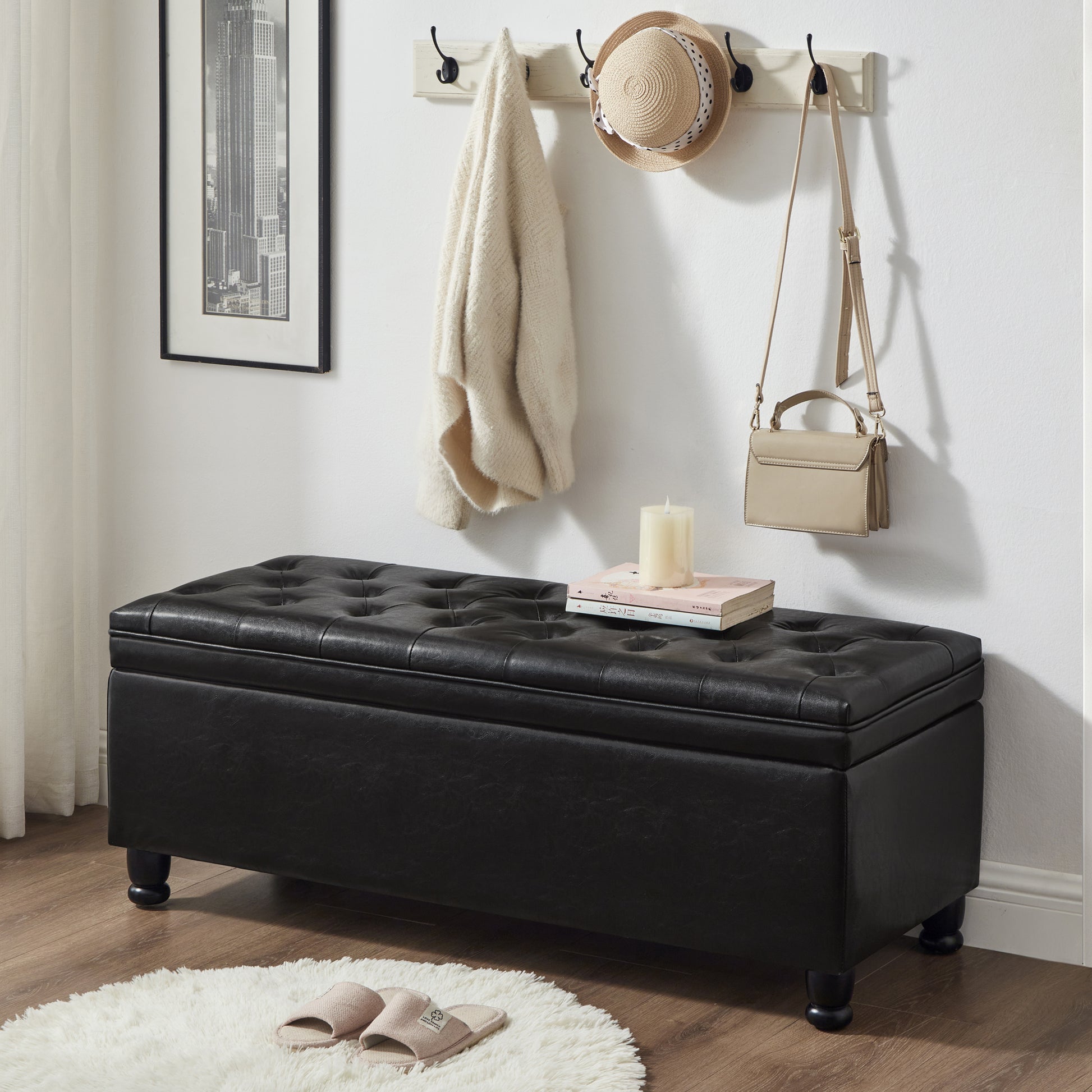 Black faux leather tufted storage ottoman with dark wooden legs
