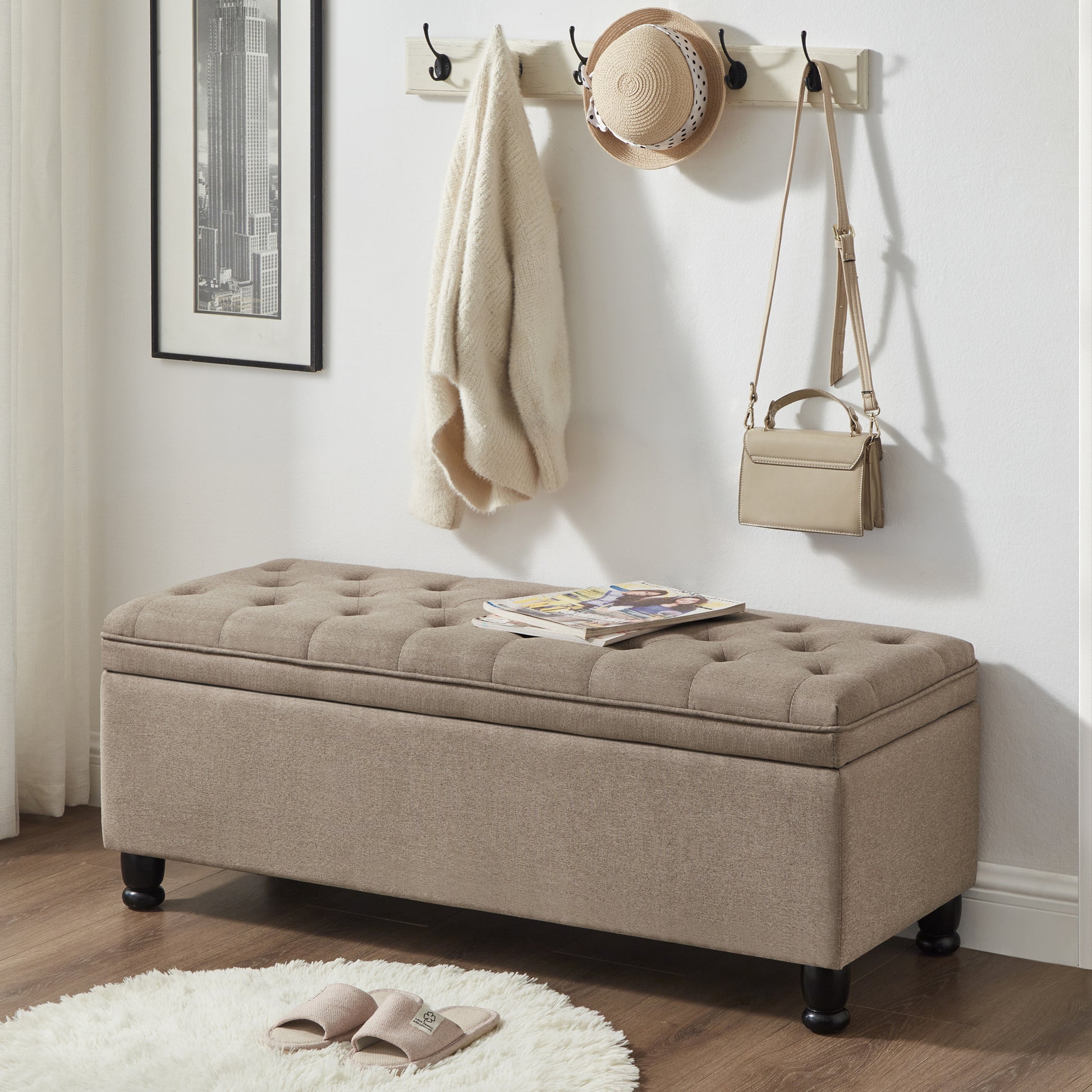 Tufted beige storage ottoman with dark wooden legs