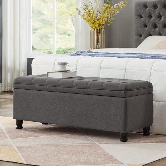 Dark gray tufted storage ottoman with hidden lifttop bench