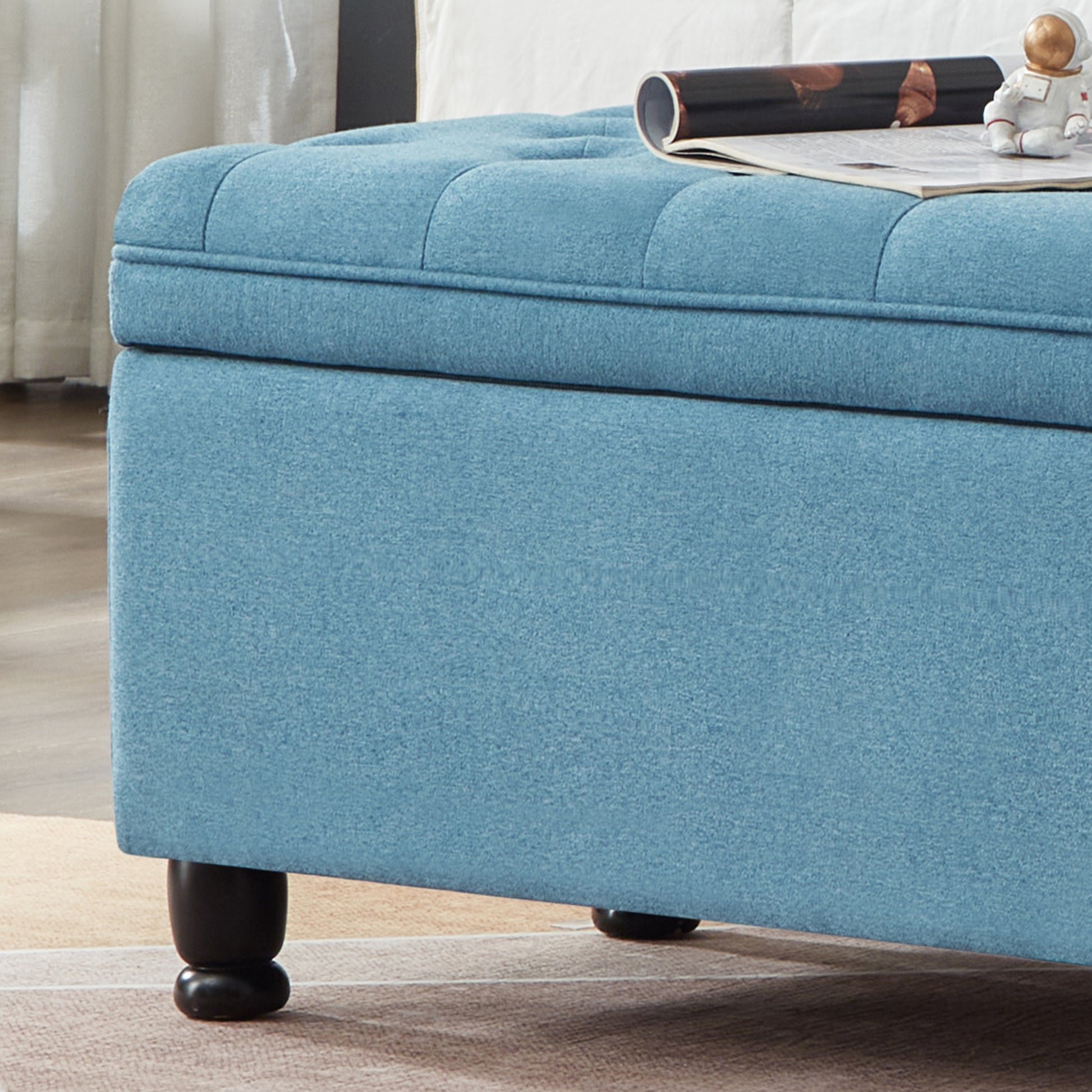 Tufted lid blue storage ottoman