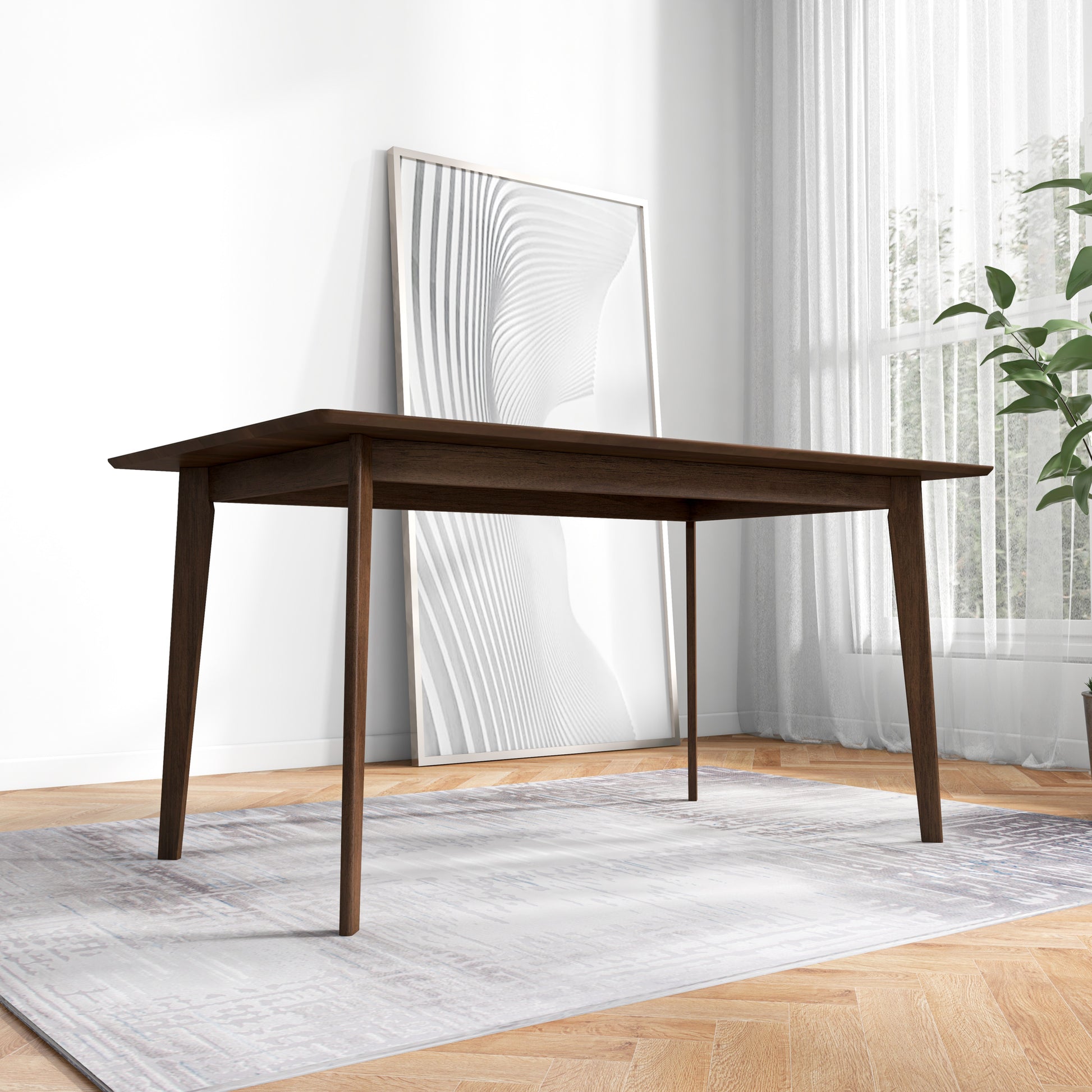 Dark wood dining table with tapered legs on a patterned rug