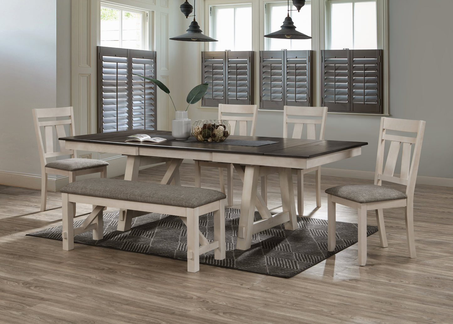 Cream and dark wood dining table with upholstered bench and chairs
