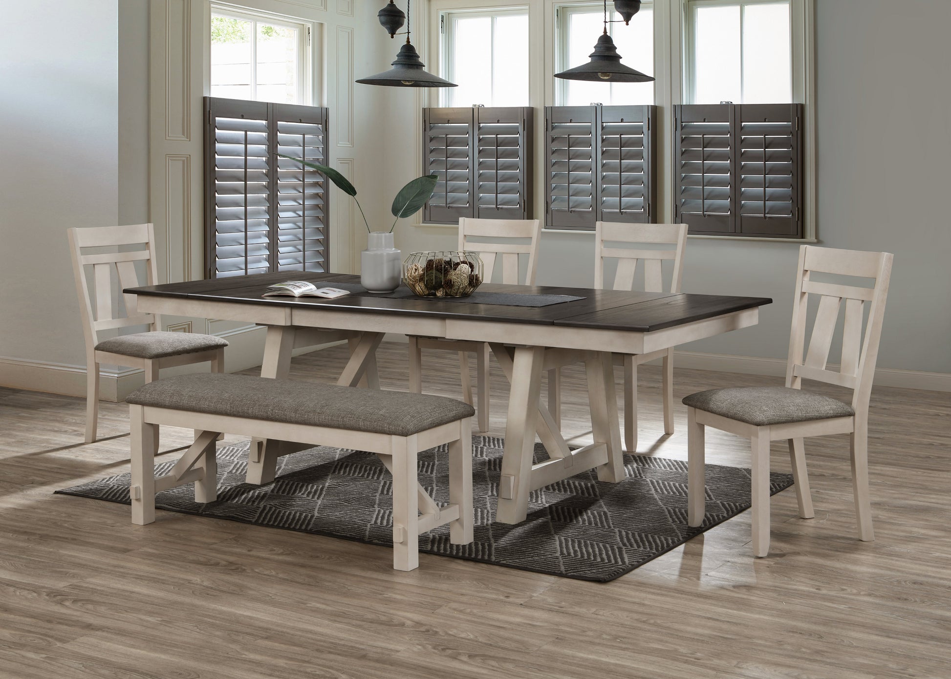 Cream and dark wood dining table with upholstered bench and chairs