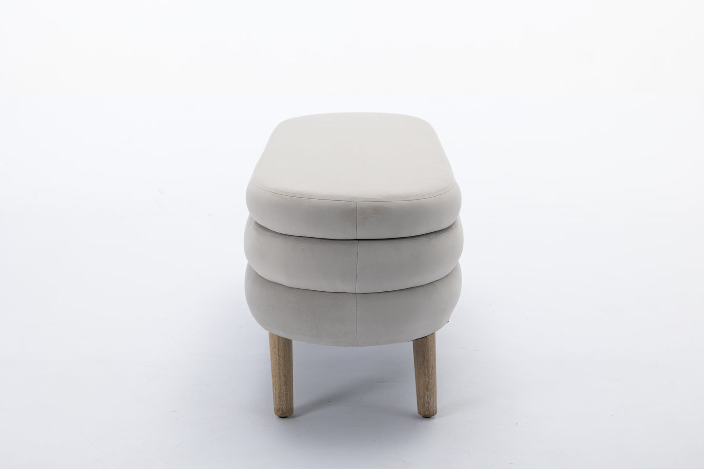 Cream upholstered bench with stacked design and wooden legs