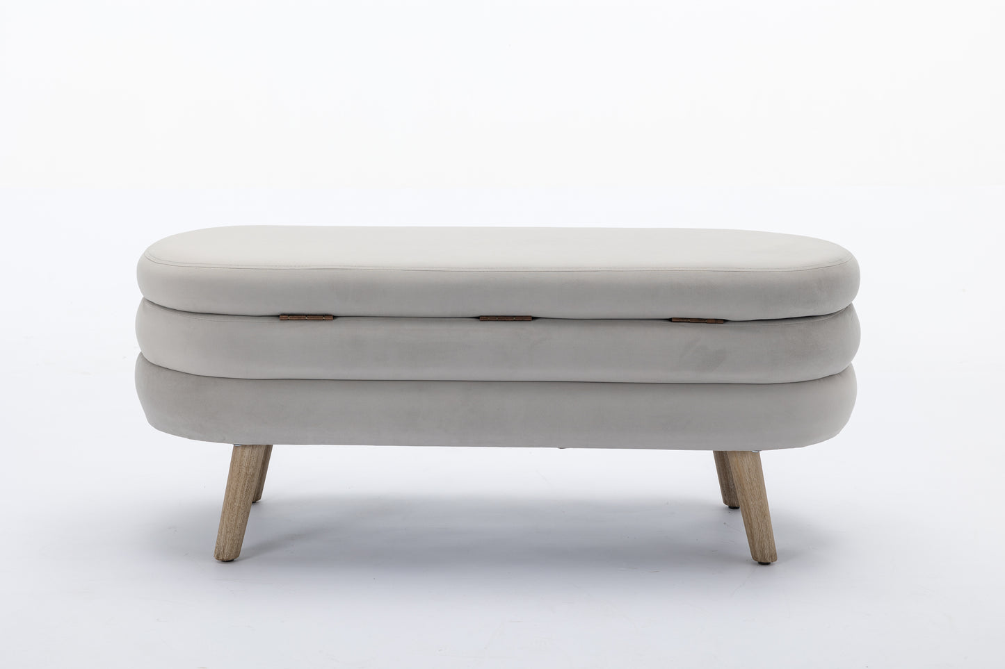 Light grey velvet storage ottoman with three stacked sections and wooden legs