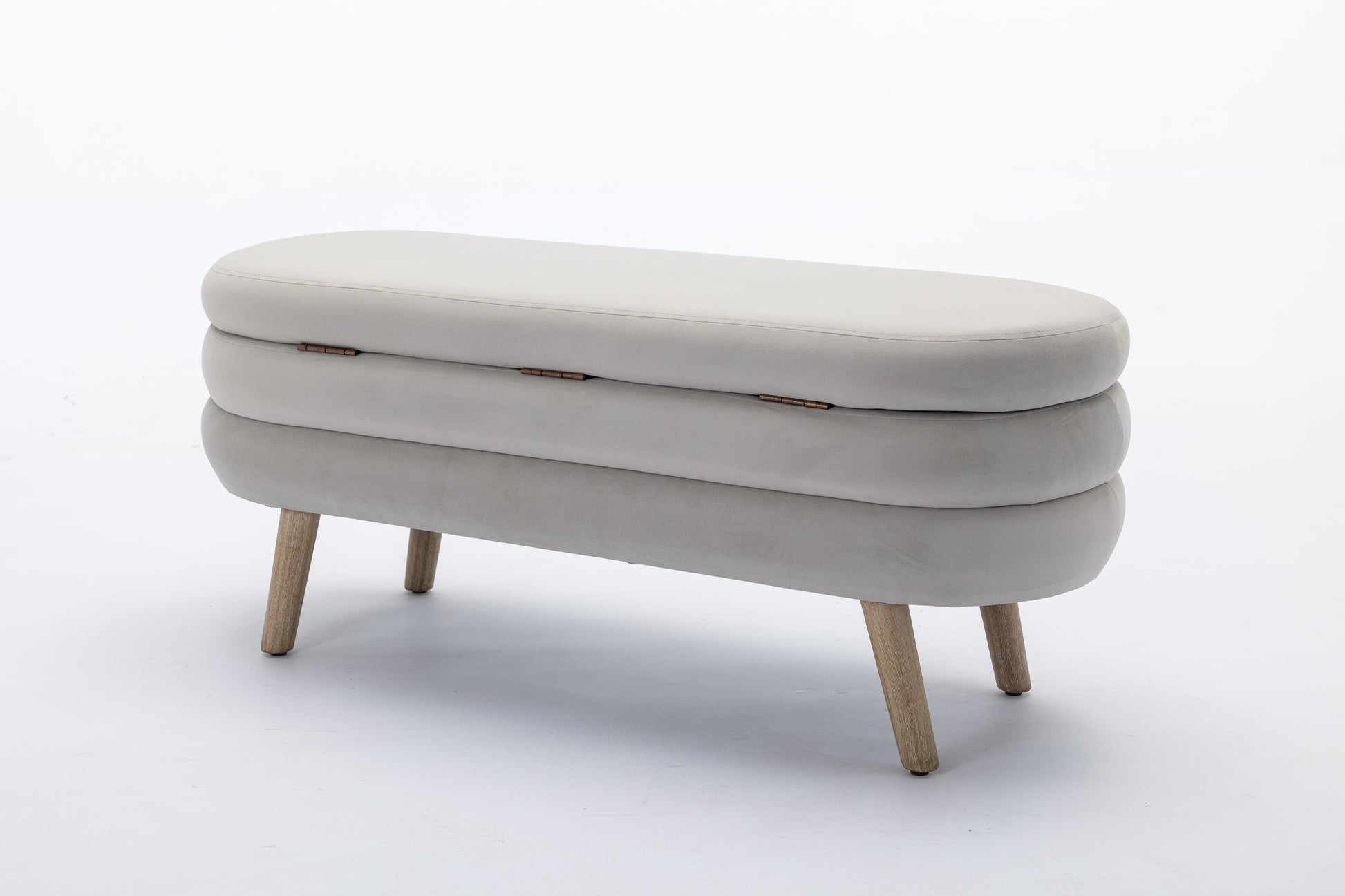 Gray velvet storage bench with hinged lid and wooden legs