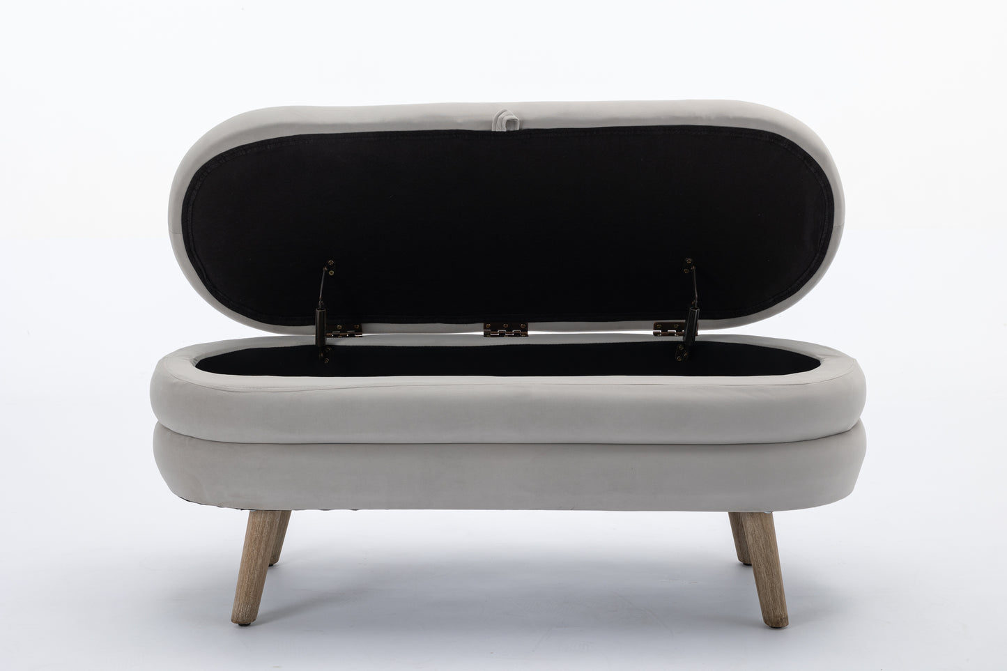Light grey upholstered storage ottoman with open lid