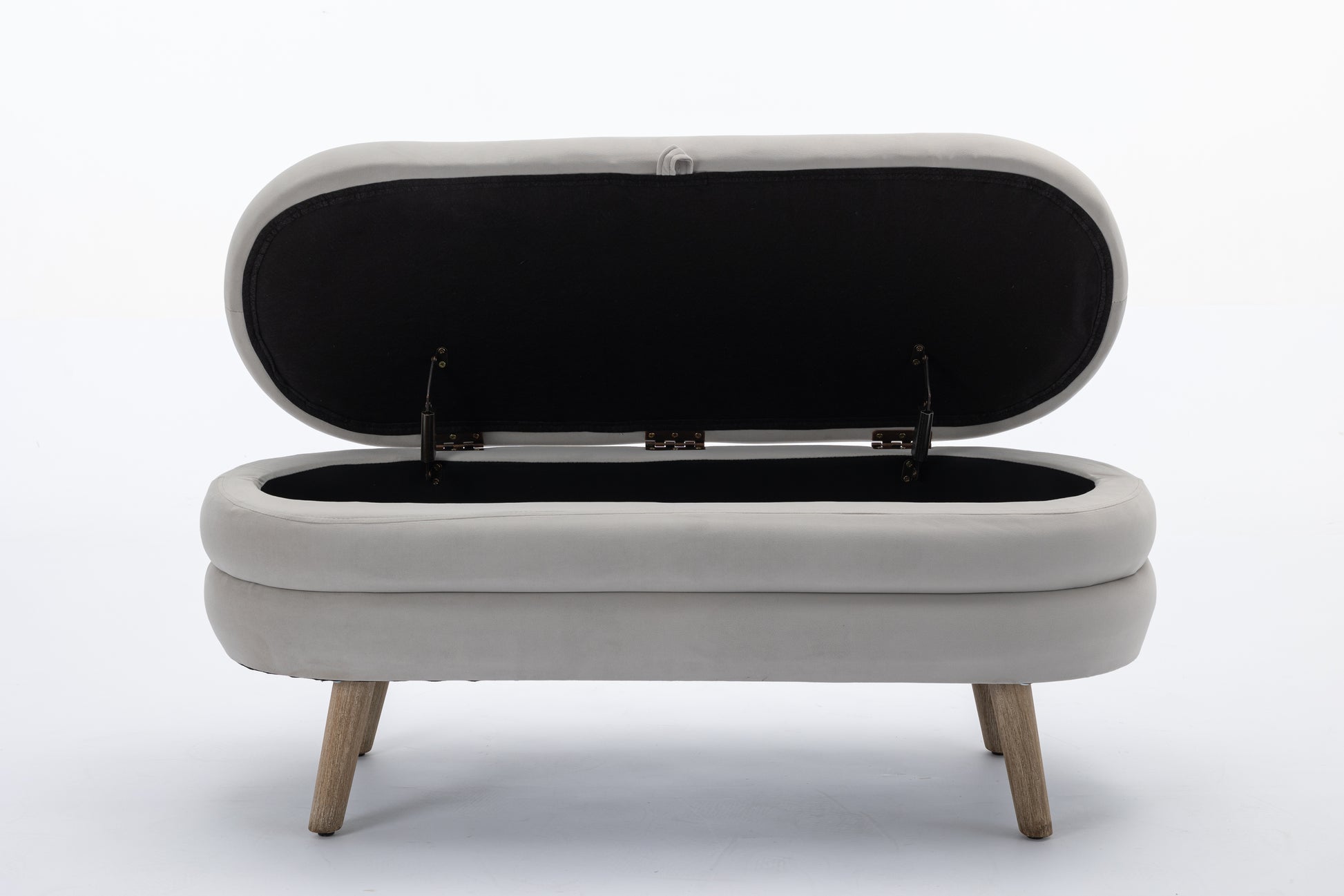 Light grey upholstered storage ottoman with open lid