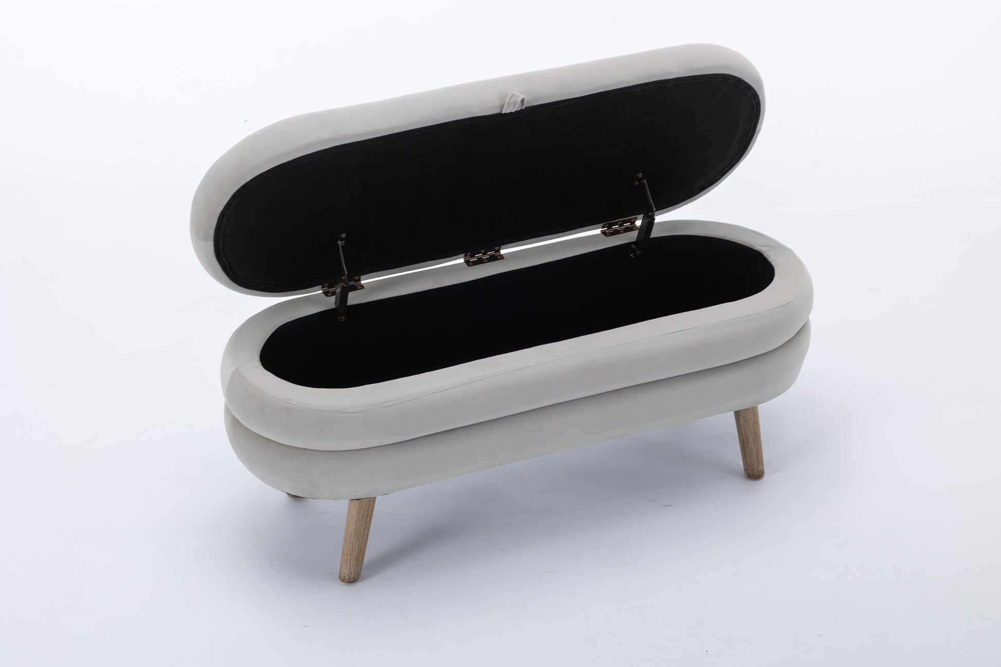 Open light gray velvet storage ottoman with hinged lid and wooden legs