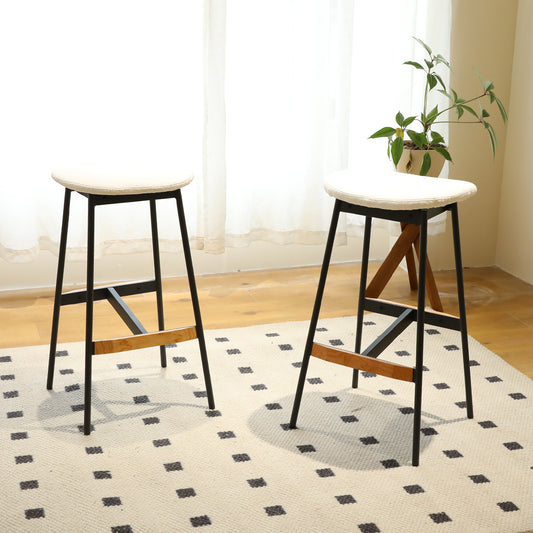Pair of modern black metal bar stools with white cushioned seats