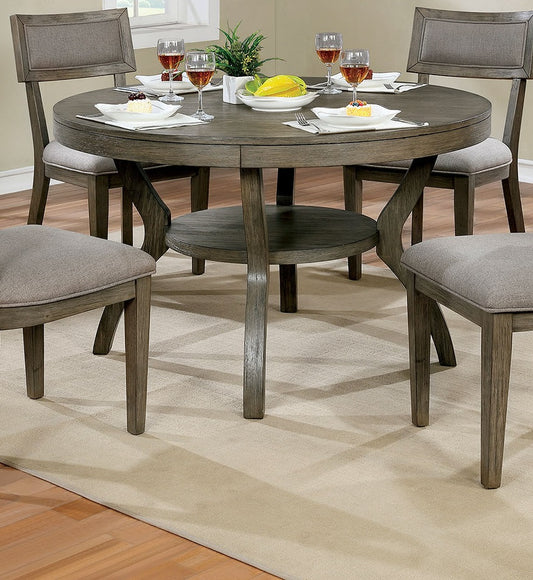 Round gray dining table with upholstered chairs