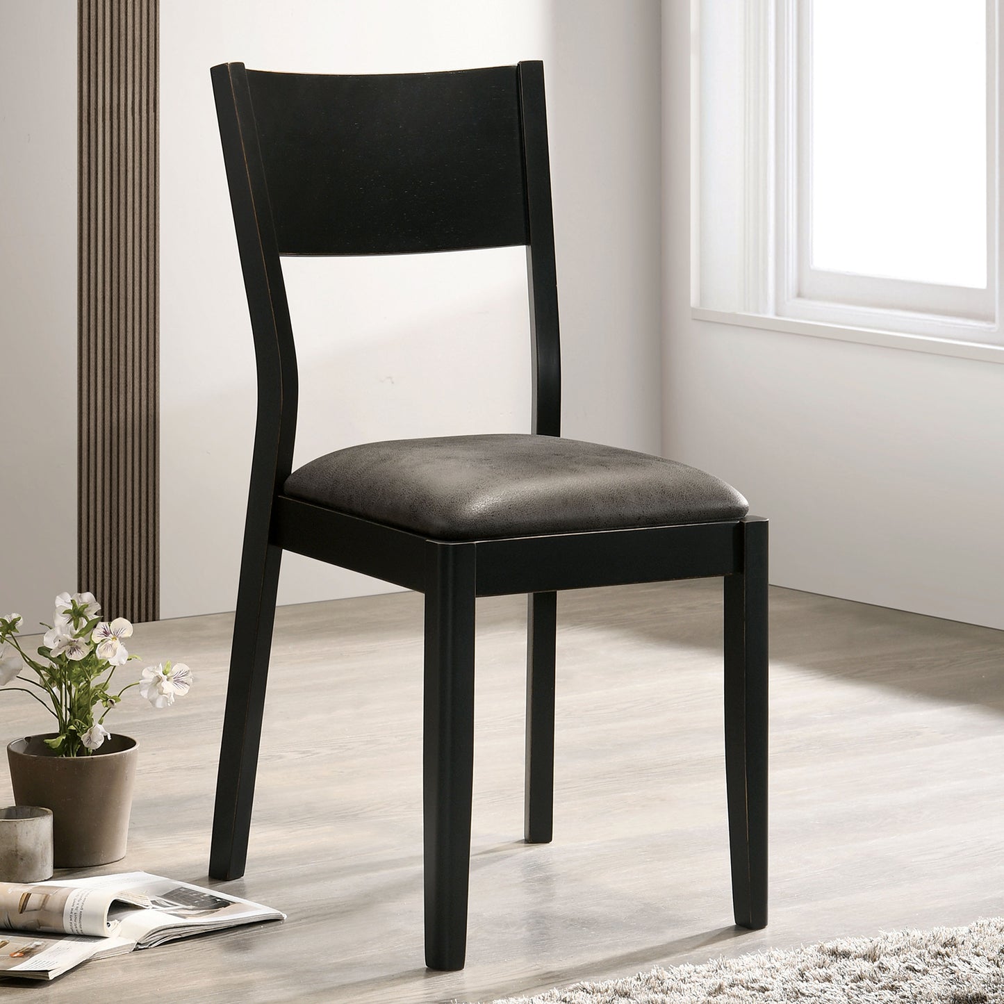 Modern black wooden dining chair with gray upholstered seat