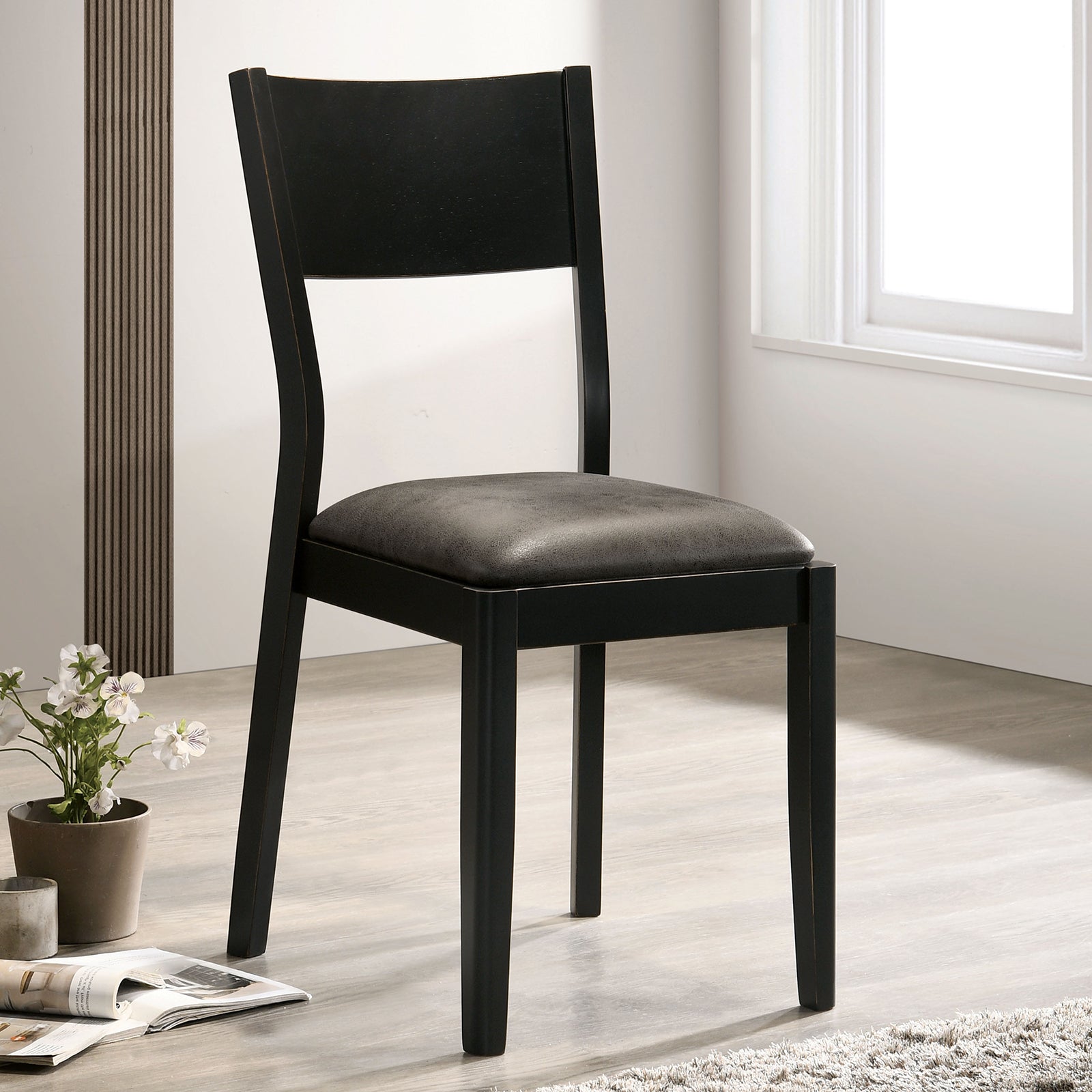 Modern black wooden dining chair with gray upholstered seat
