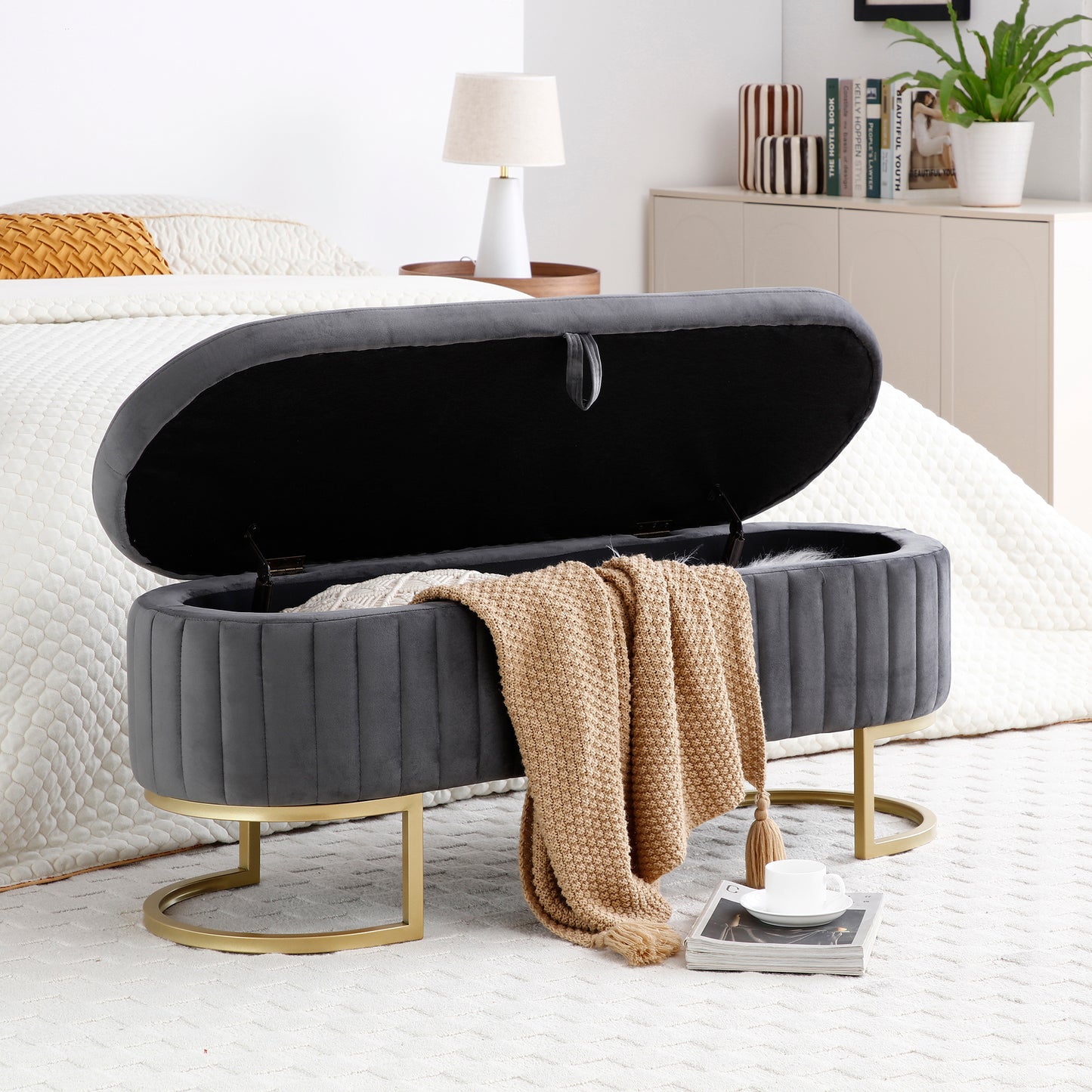 Gray velvet storage bench with gold legs