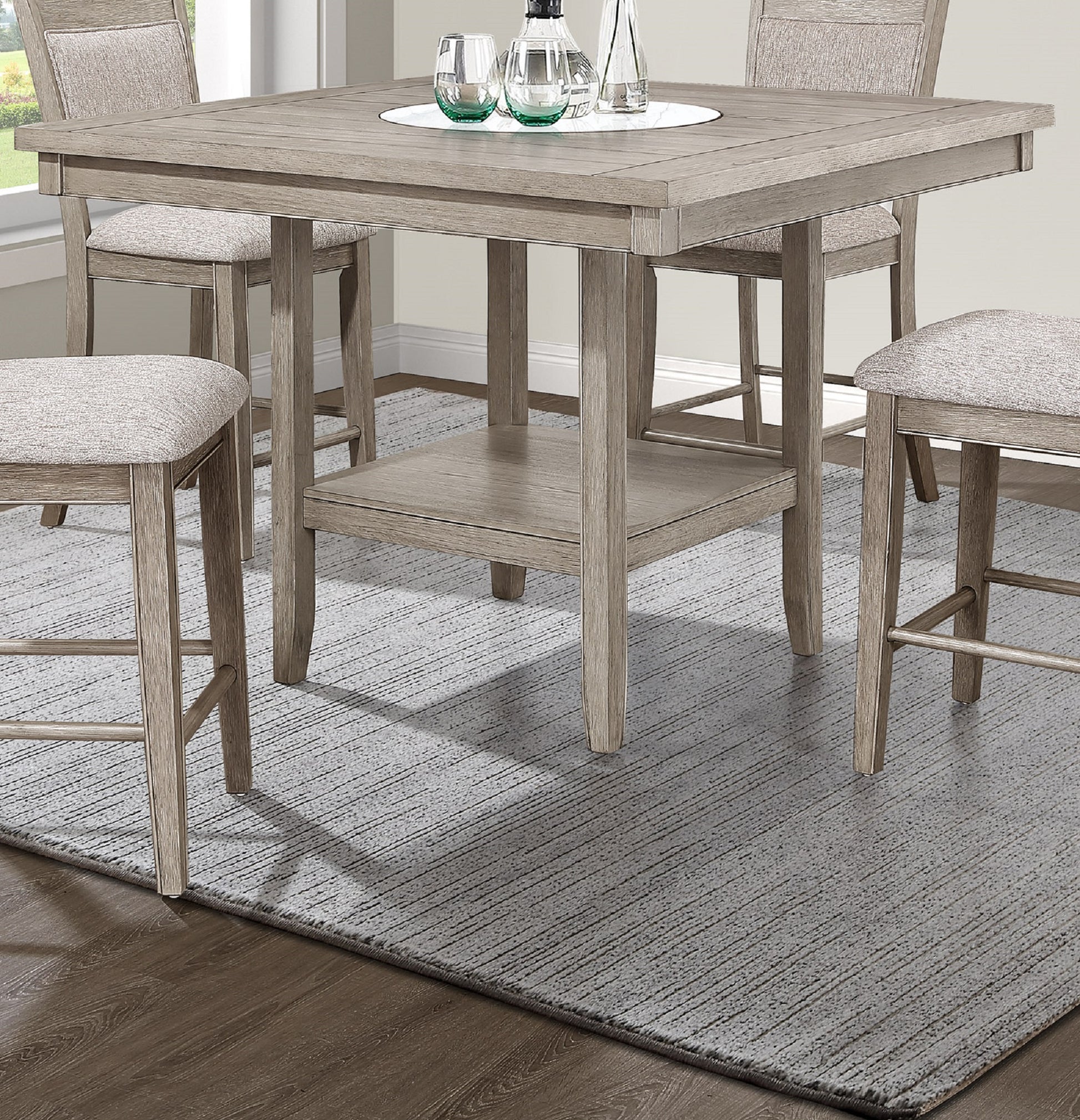 Rustic grey wood counter height table with cushioned stools