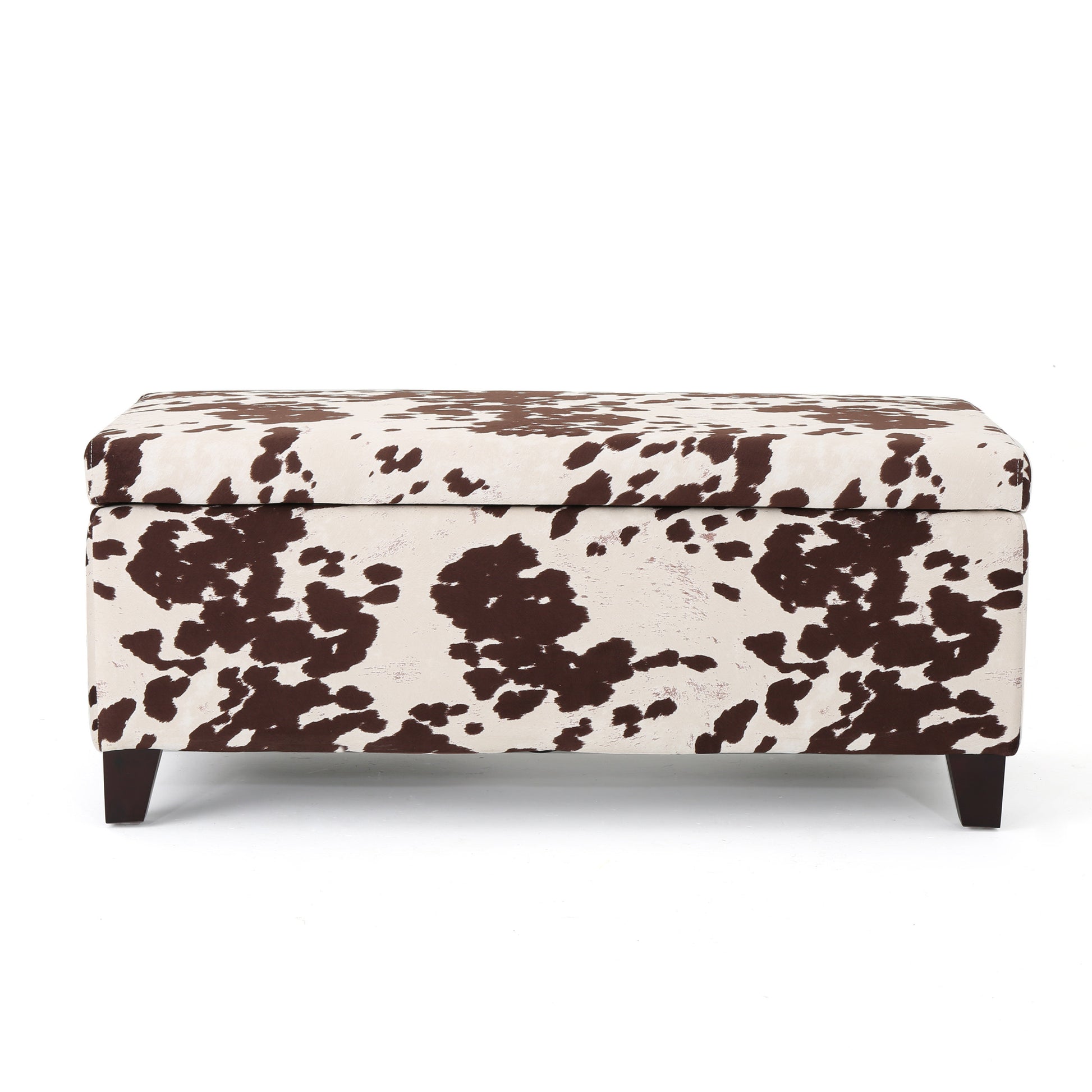 Brown and white cowhide print storage ottoman with dark wood legs