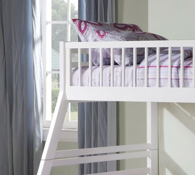 White wooden bunk bed with patterned bedding