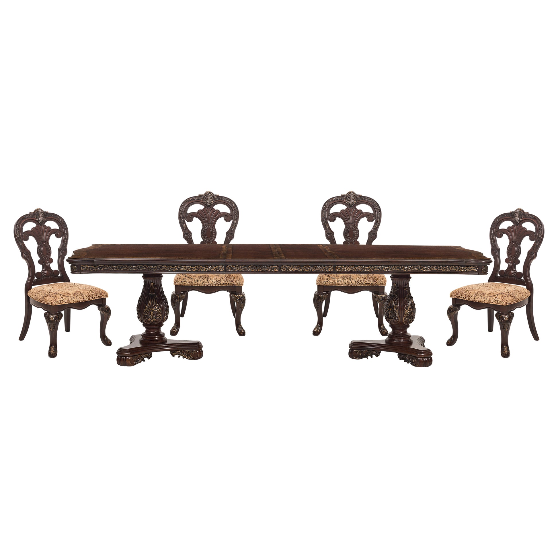 Ornate mahogany dining table with carved details and four upholstered chairs