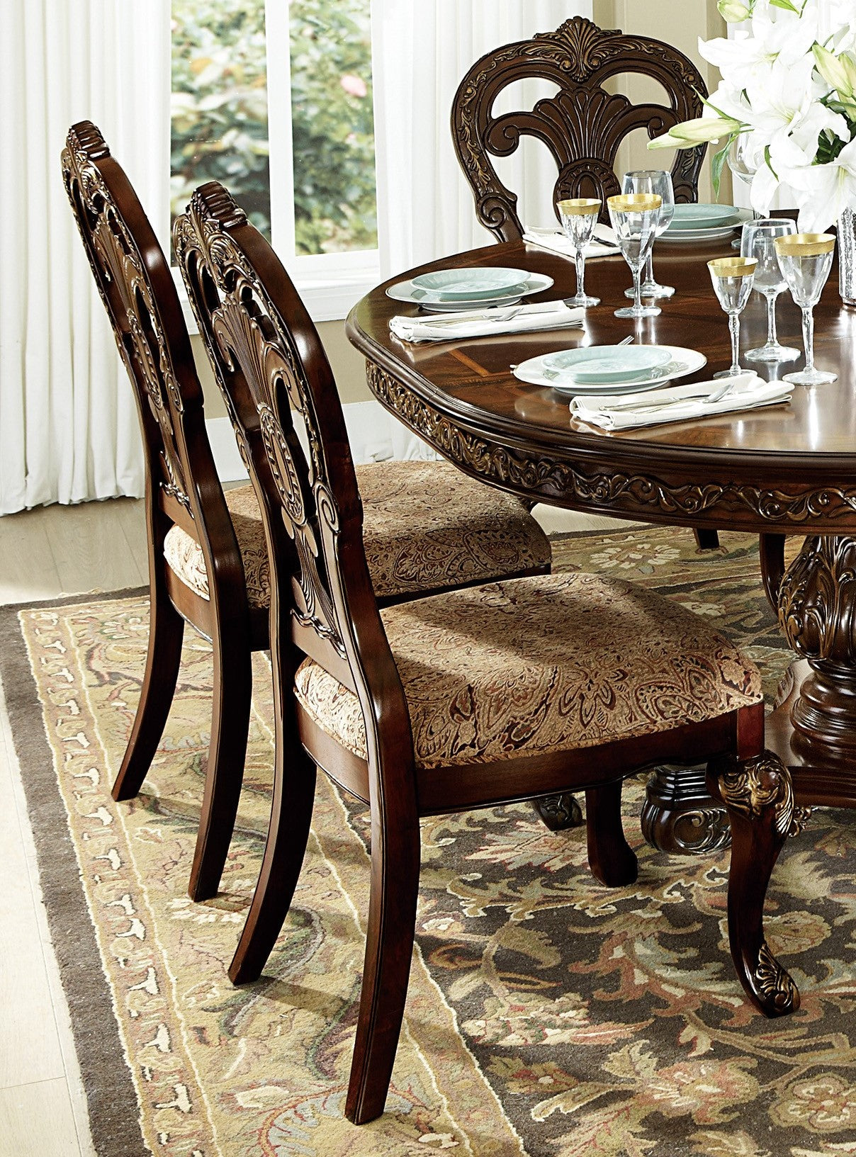 Elegant dark wood dining chair with ornate carvings and patterned upholstered seat
