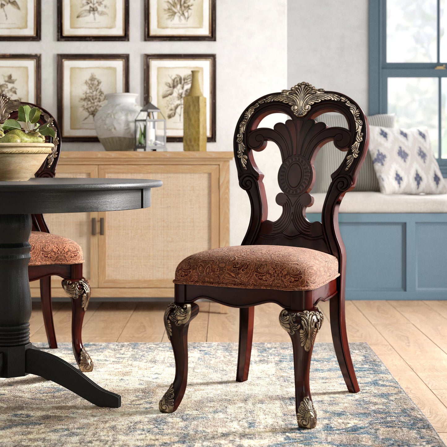 Dark cherry wood dining chair with ornate gold accents and patterned upholstery