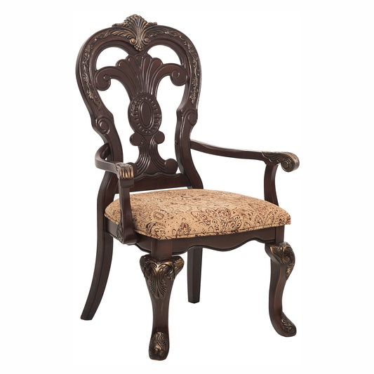 Dark brown wooden armchair with ornate carved details and a patterned fabric seat