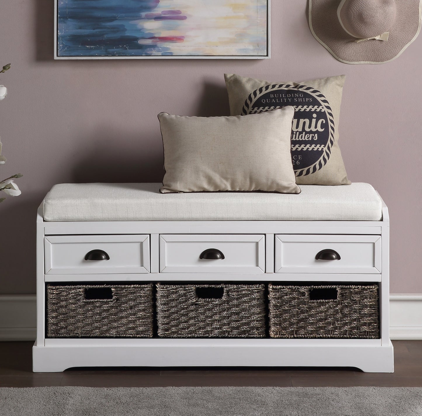 White entryway bench with upholstered seat three drawers and three wicker baskets