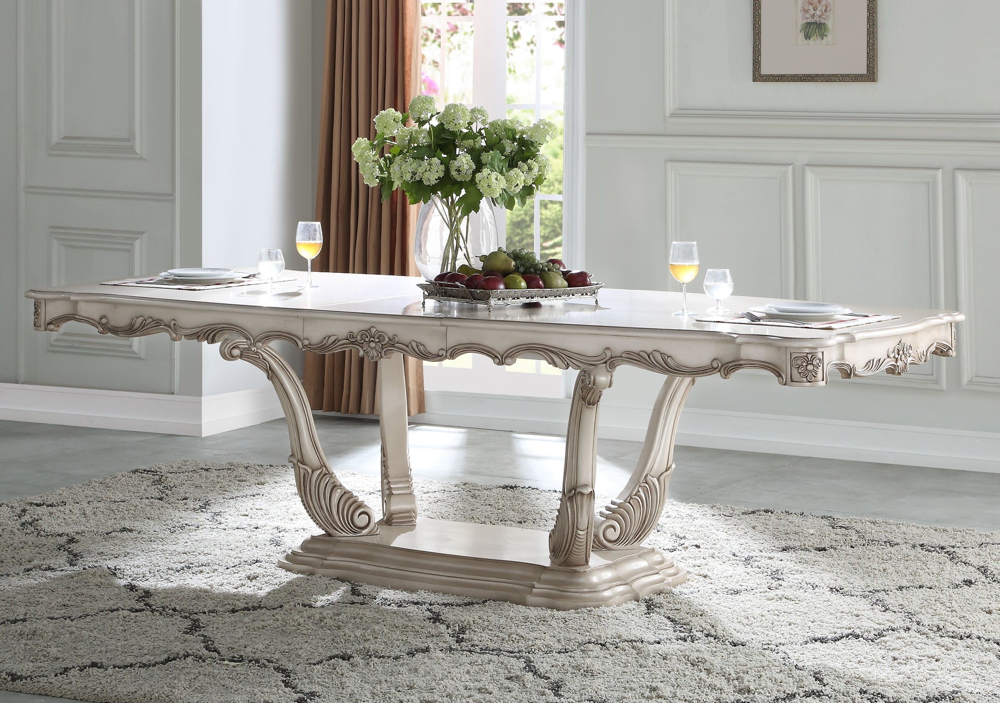 Elegant antique white dining table with ornate carved legs
