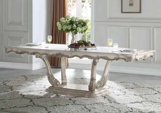 Elegant antique white dining table with ornate carved legs
