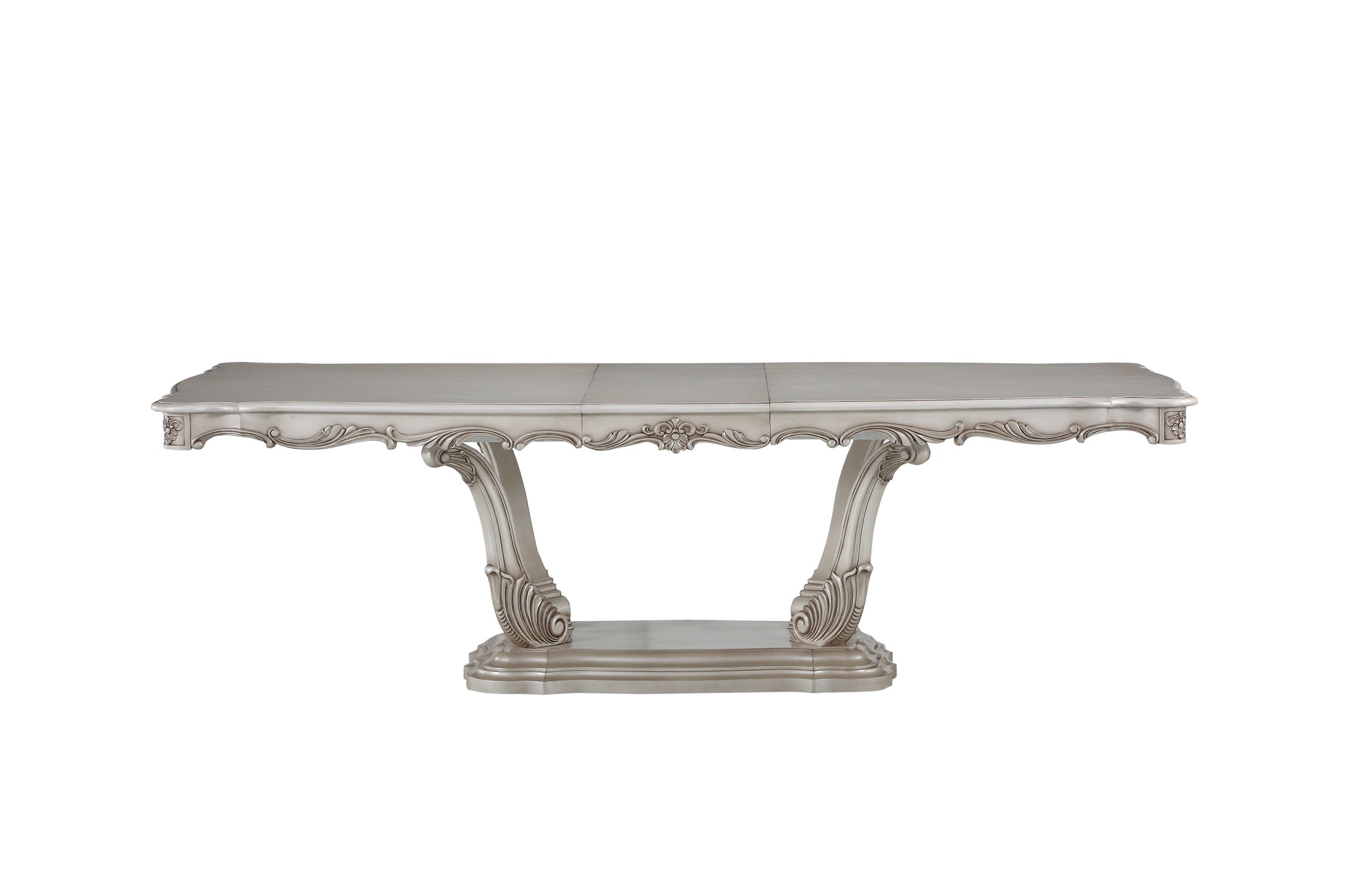 Antique silver dining table with ornate carved legs