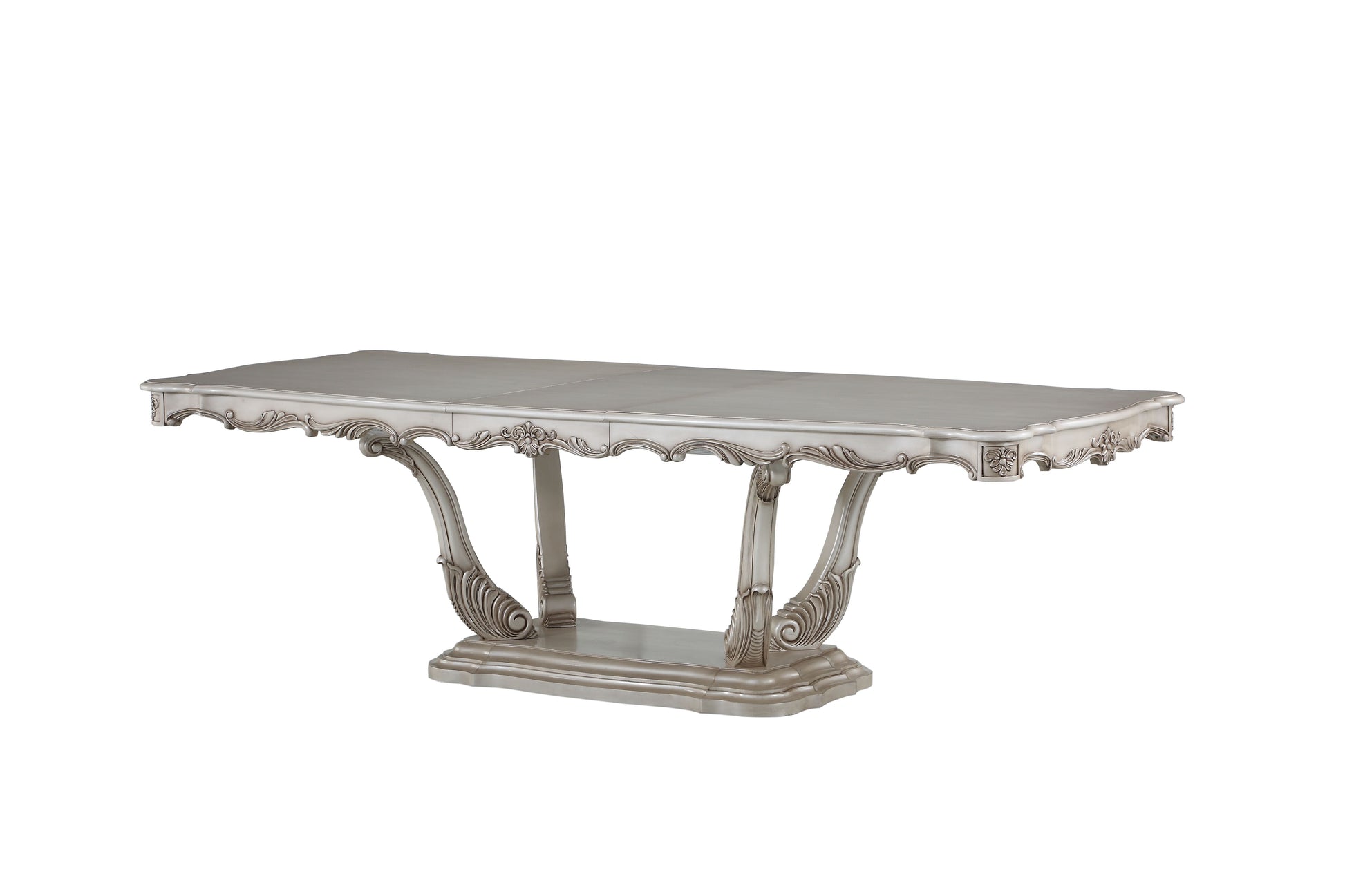 Elegant silver dining table with ornate scrollwork legs