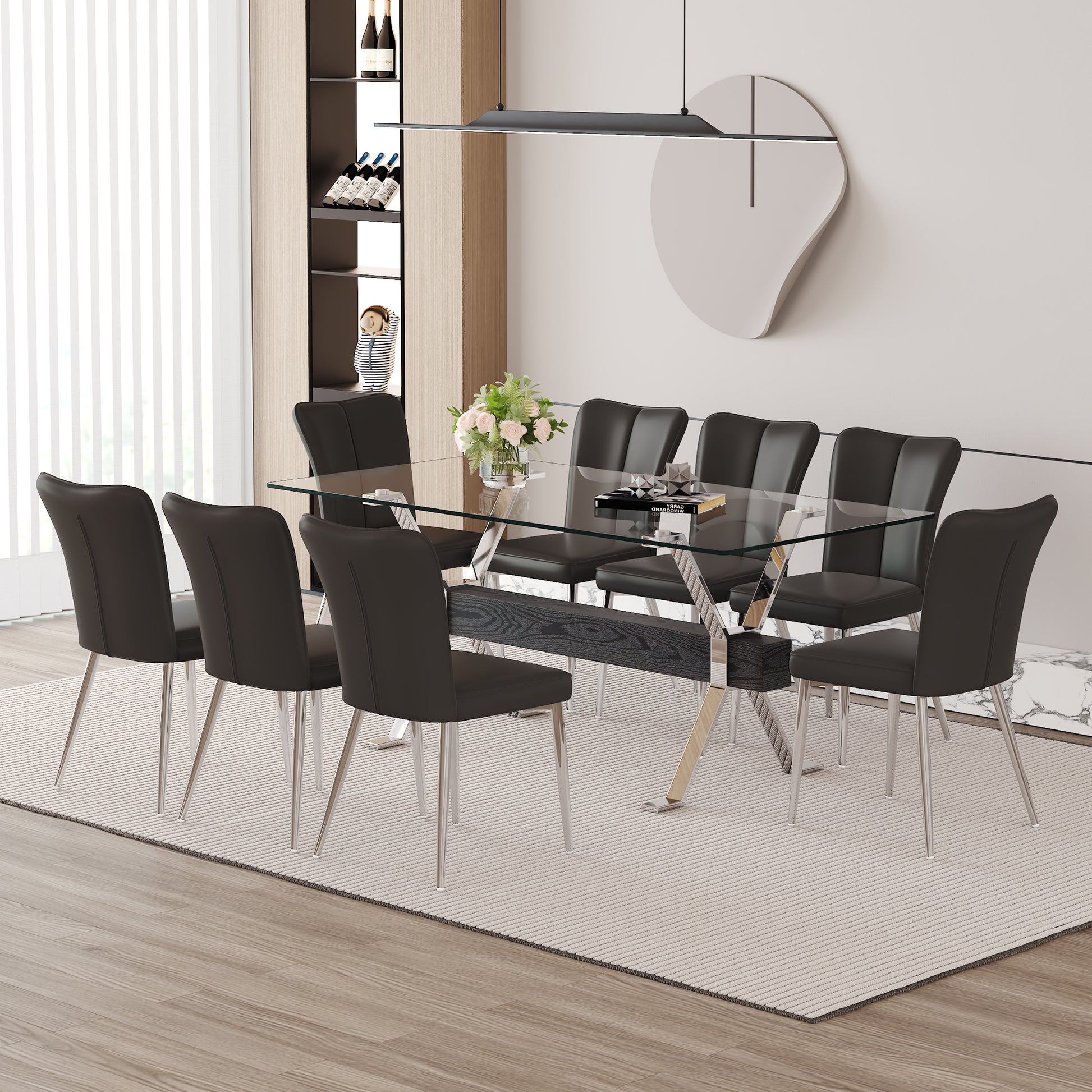 Modern glass dining table with eight black upholstered chairs and chrome legs