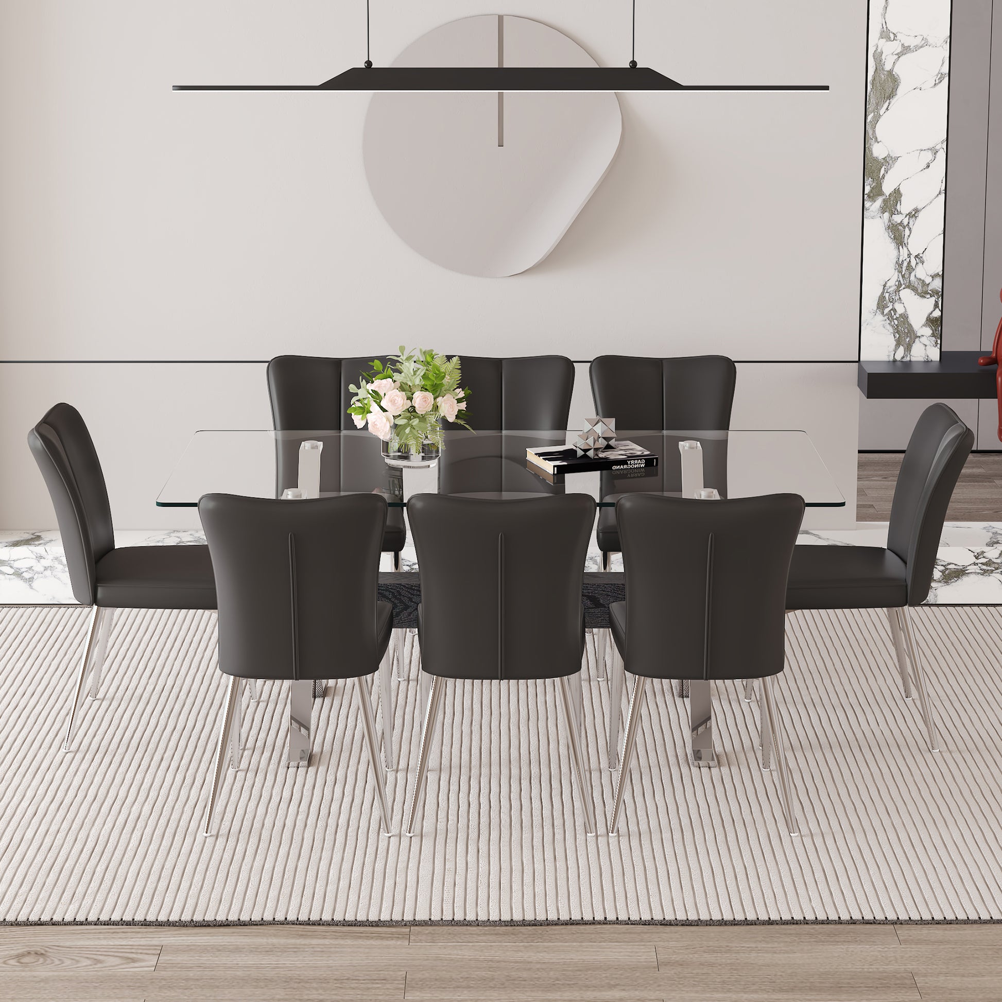 Elegant glass top dining table with eight dark grey upholstered chairs