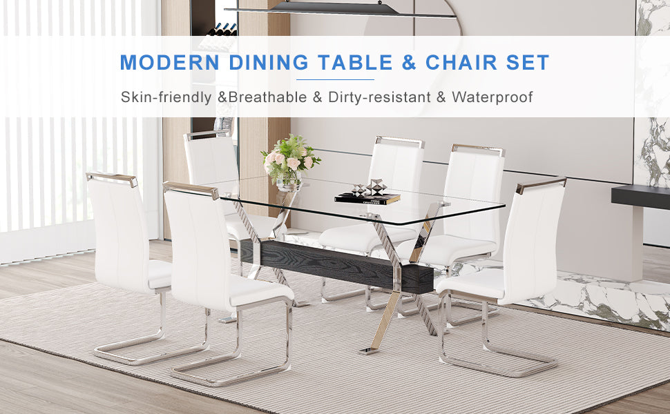 Modern glass dining table with six white faux leather chairs