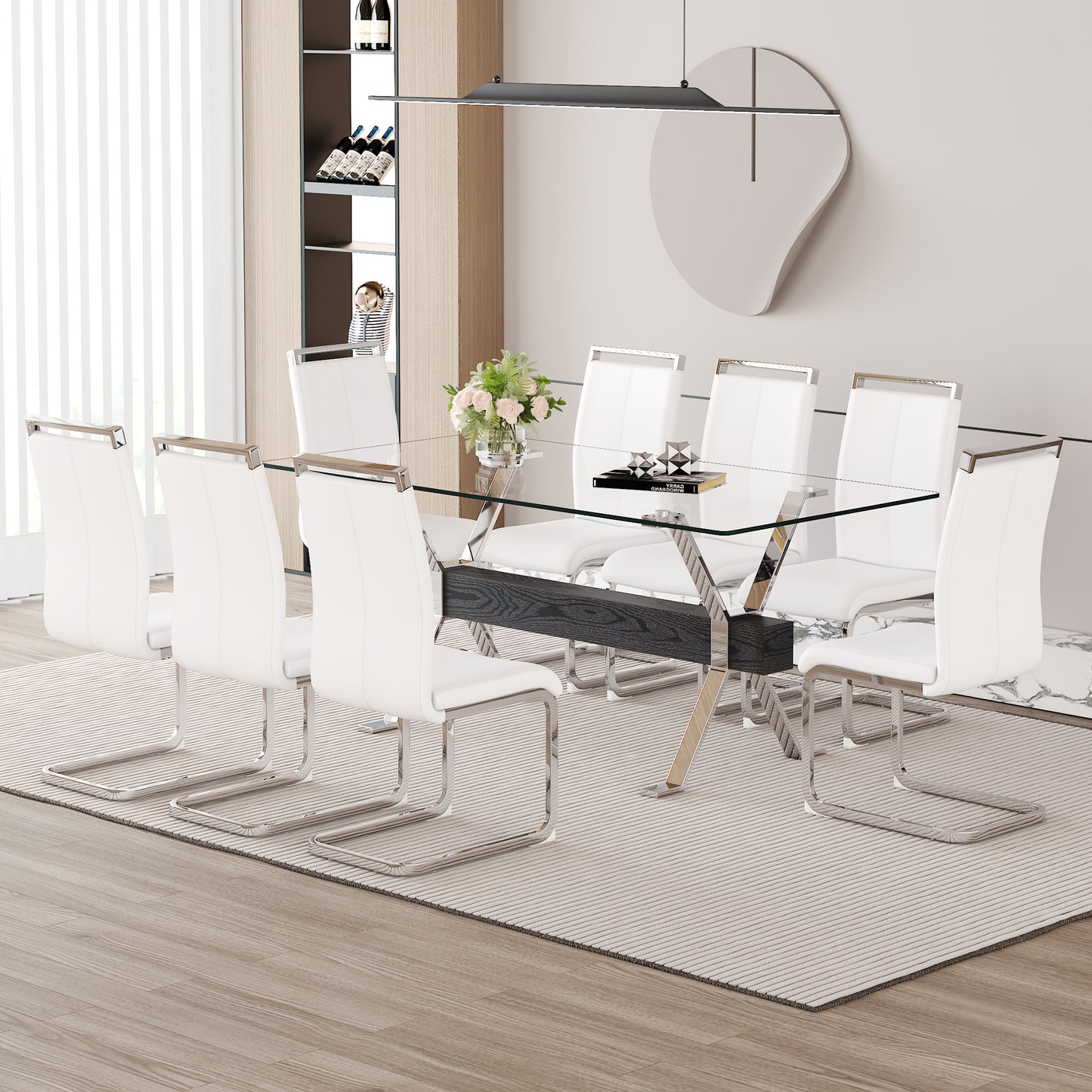 Glass top dining table with white chairs and chrome legs
