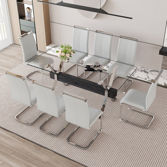 Modern dining set with white leather chairs and glass tabletop